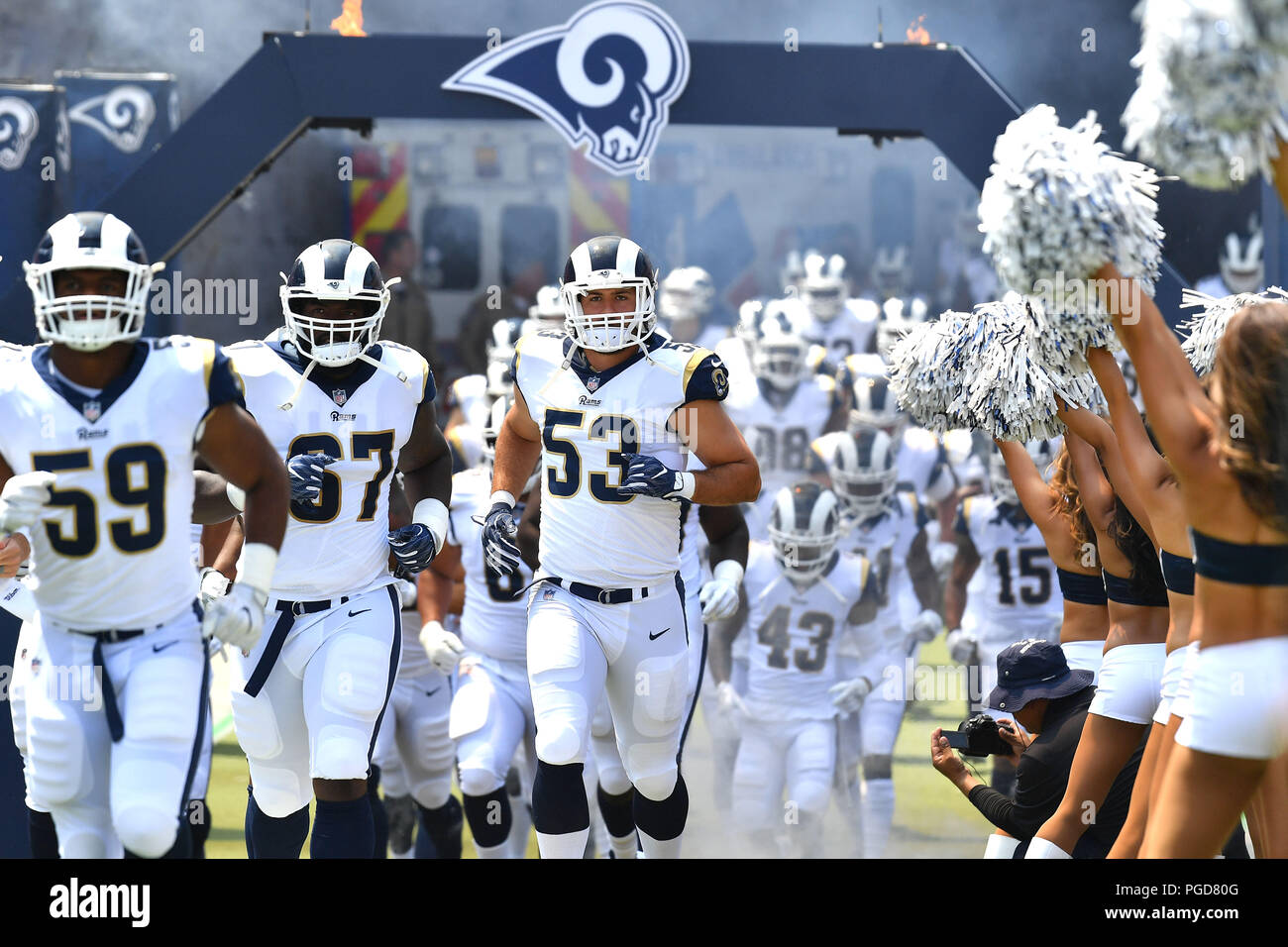 Los Angeles, USA. 25 August 2018. The Los Angeles Rams linebacker Carlos Thompson #53, Los Angeles Rams linebacker Micah Kiser #59 and Los Angeles Rams defensive tackle Chunky Clements #67 take the field before the NFL Preseason football game against the Houston Texans at the Los Angeles Memorial Coliseum in Los Angeles, California.Mandatory Photo Credit: Louis Lopez/CSM Credit: Cal Sport Media/Alamy Live News Stock Photo
