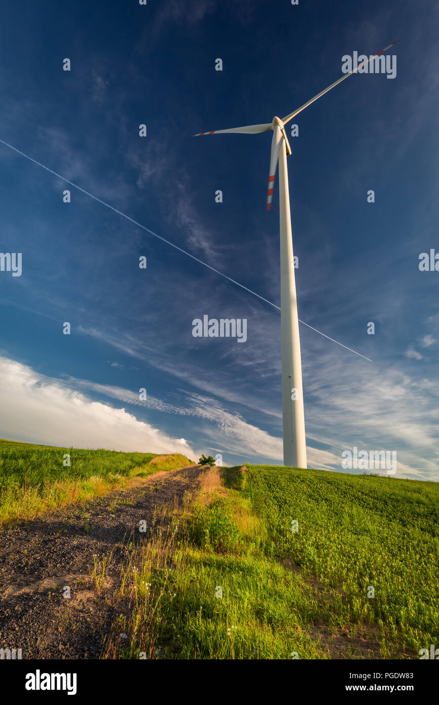 Wind turbines on green field and blue sky in countryside Stock Photo ...