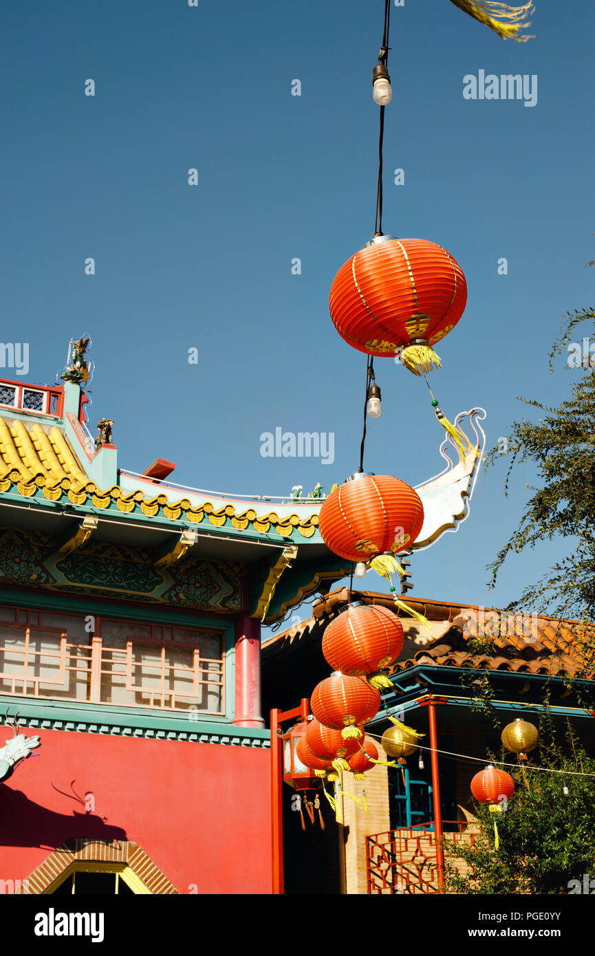 Red paper lanterns hang from Asian inspired architecture in Chinatown