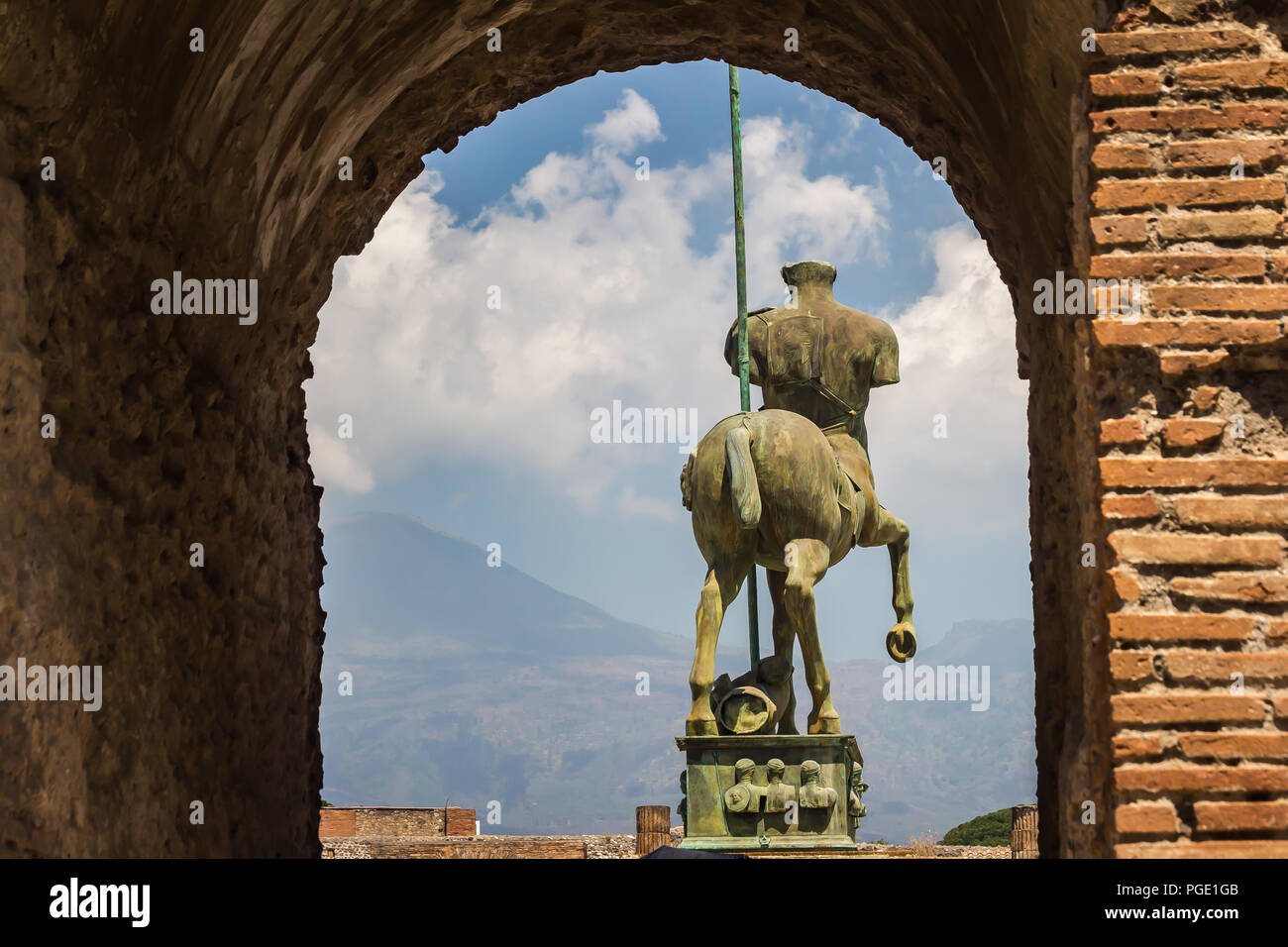 Pompei, near Naples, Italy - June 1, 2018 - Statue 'Centauro' by modern Polish artist Igor Mitoraj, overlooking ruins of Pompei Stock Photo