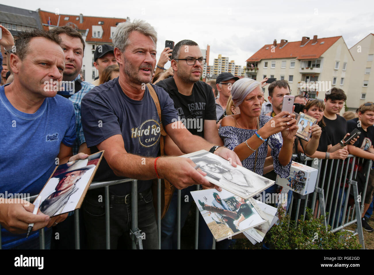 Worms, Germany. 24th Aug, 2018. Fans shout towards Terence Hill and wave things for him to sign. Italian actor Terence Hill visited the German city of Worms, to present his new movie (My Name is somebody). Terence Hill added the stop in Worms to his movie promotion tour in Germany, to visit a pedestrian bridge, that is unofficially named Terence-Hill-Bridge (officially Karl-Kubel-Bridge). Credit: Michael Debets/Pacific Press/Alamy Live News Stock Photo