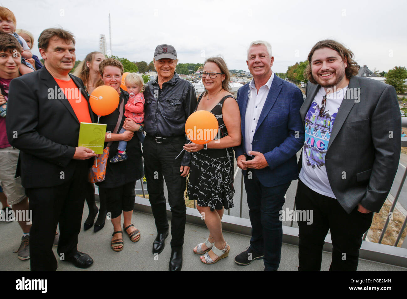 Actor Peter Englert (right), who initiated the renaming of the bridge to Terence-Hill-Bridge, Terence Hill (4th right) and the Lord Mayor of Worms Michael Kissel (2nd right) pose with members of the Karl-Kubel-Foundation for the press. Italian actor Terence Hill visited the German city of Worms, to present his new movie (My Name is somebody). Terence Hill added the stop in Worms to his movie promotion tour in Germany, to visit a pedestrian bridge, that is unofficially named Terence-Hill-Bridge (officially Karl-Kubel-Bridge). (Photo by Michael Debets/Pacific Press) Stock Photo