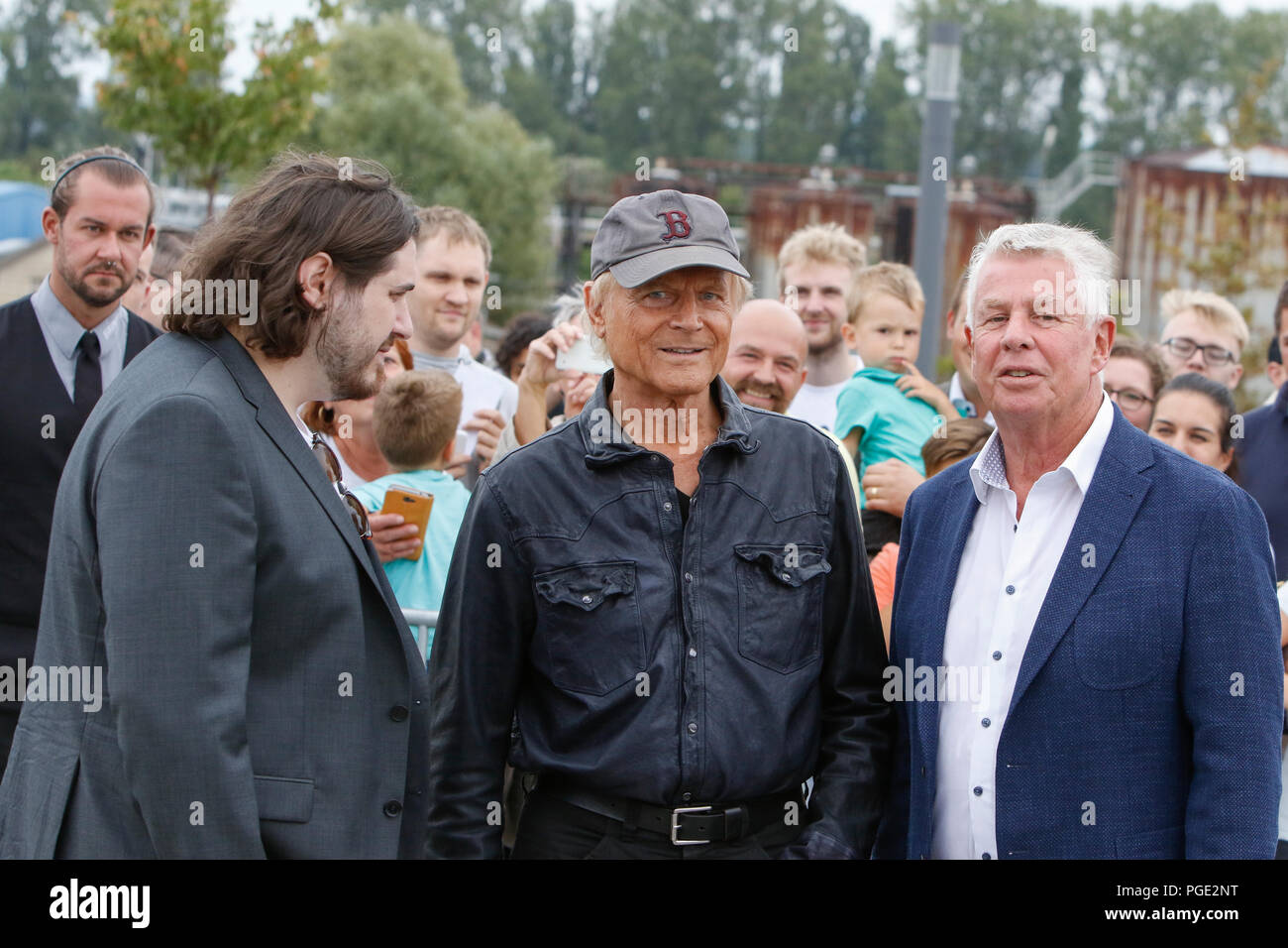 Worms, Germany. 24th Aug, 2018. Actor Peter Englert, who initiated the renaming of the bridge to Terence-Hill-Bridge, Terence Hill and the Lord Mayor of Worms Michael Kissel are pictured from left to right. Italian actor Terence Hill visited the German city of Worms, to present his new movie (My Name is somebody). Terence Hill added the stop in Worms to his movie promotion tour in Germany, to visit a pedestrian bridge, that is unofficially named Terence-Hill-Bridge (officially Karl-Kubel-Bridge). Credit: Michael Debets/Pacific Press/Alamy Live News Stock Photo