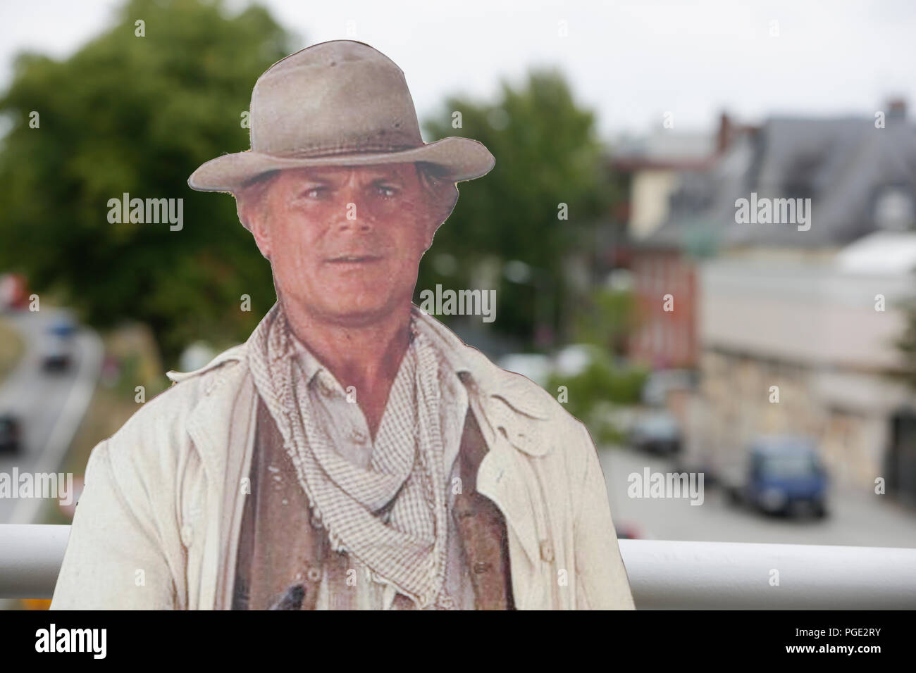 Worms, Germany. 24th Aug, 2018. A cardboard cut-out of Terence Hill stands on the bridge. Italian actor Terence Hill visited the German city of Worms, to present his new movie (My Name is somebody). Terence Hill added the stop in Worms to his movie promotion tour in Germany, to visit a pedestrian bridge, that is unofficially named Terence-Hill-Bridge (officially Karl-Kubel-Bridge). Credit: Michael Debets/Pacific Press/Alamy Live News Stock Photo