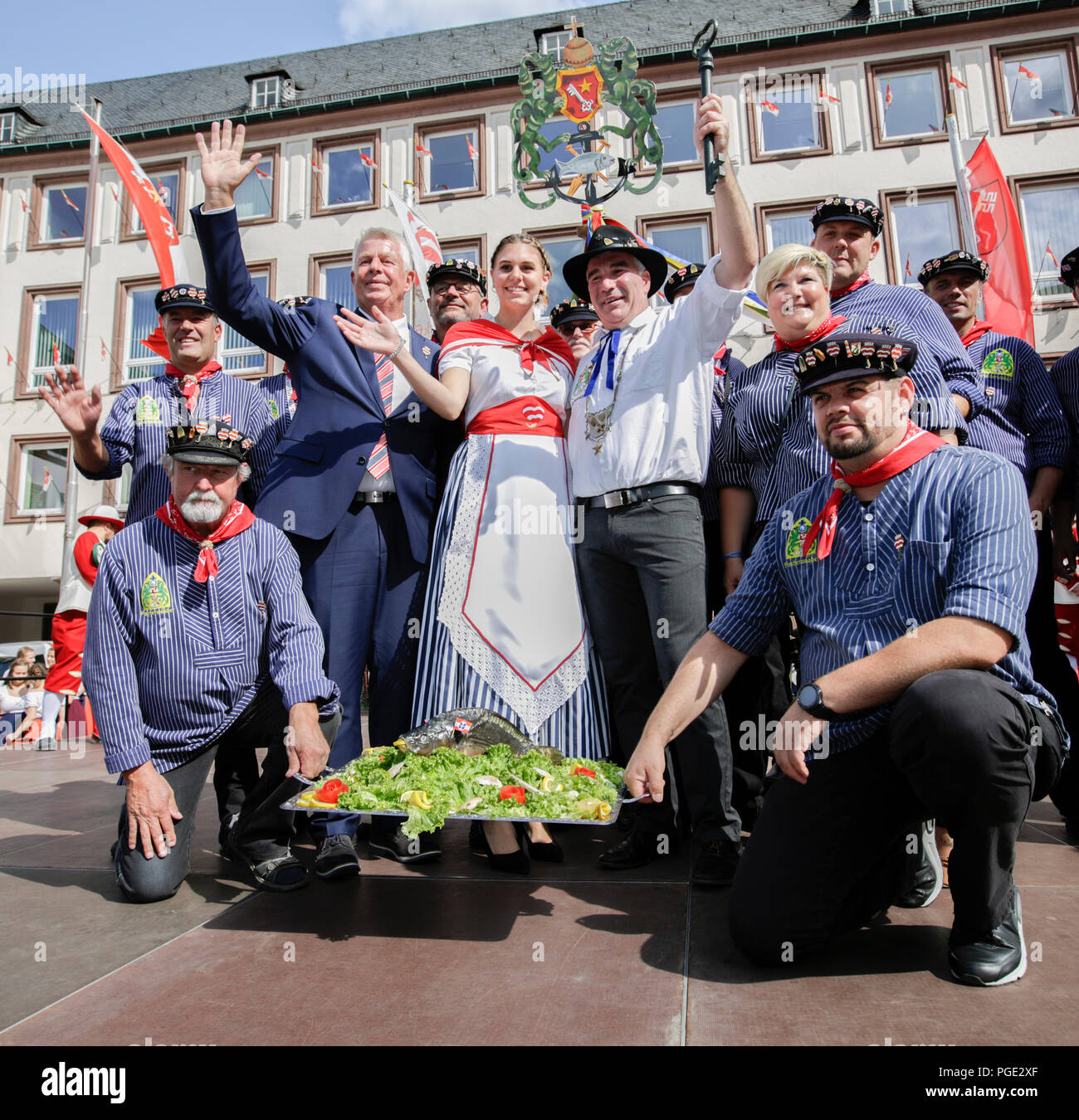 The Bojemääschter vun de Fischerwaad (mayor of the fishermen's lea), Markus Trapp( middle, right), his bride Beatrice Duda (middle, middle) and the Lord Mayor of Worms Michael Kissel (middle, left) pose for the cameras surrounded by the delegation from the Fischerwaad (fishermen's lea) area, where the fishermen used to live in the past. The largest wine and funfair along the Rhine, the Backfischfest started in Worms with the traditional handing over of power from the Lord Mayor to the mayor of the fishermen's lea. The ceremony was framed by dances and music. (Photo by Michael Debets/Pacific Pr Stock Photo
