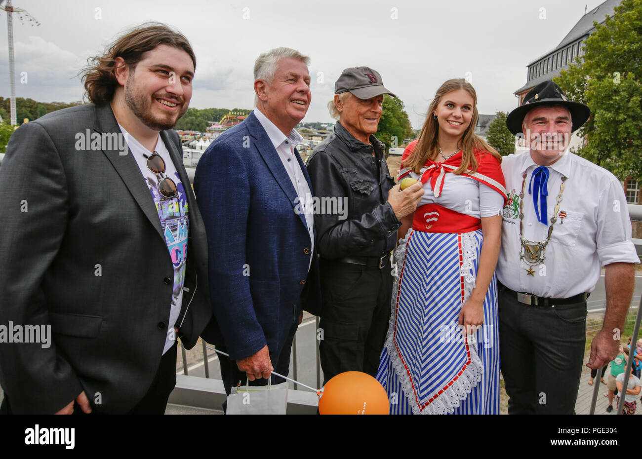 Actor Peter Englert, who initiated the renaming of the bridge to Terence-Hill-Bridge, the Lord Mayor of Worms Michael Kissel, Terence Hill, the Backfishbide Beatrice Duda and the mayor of the fishermen's lea Markus Trapp pose from left to right for the cameras. Italian actor Terence Hill visited the German city of Worms, to present his new movie (My Name is somebody). Terence Hill added the stop in Worms to his movie promotion tour in Germany, to visit a pedestrian bridge, that is unofficially named Terence-Hill-Bridge (officially Karl-Kubel-Bridge). (Photo by Michael Debets/Pacific Press) Stock Photo