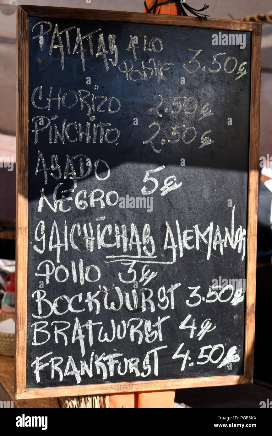 Spain, Andalusia, Frigliana. A chalkboard with a menu for take away food at the annual festival of three cultures. Stock Photo