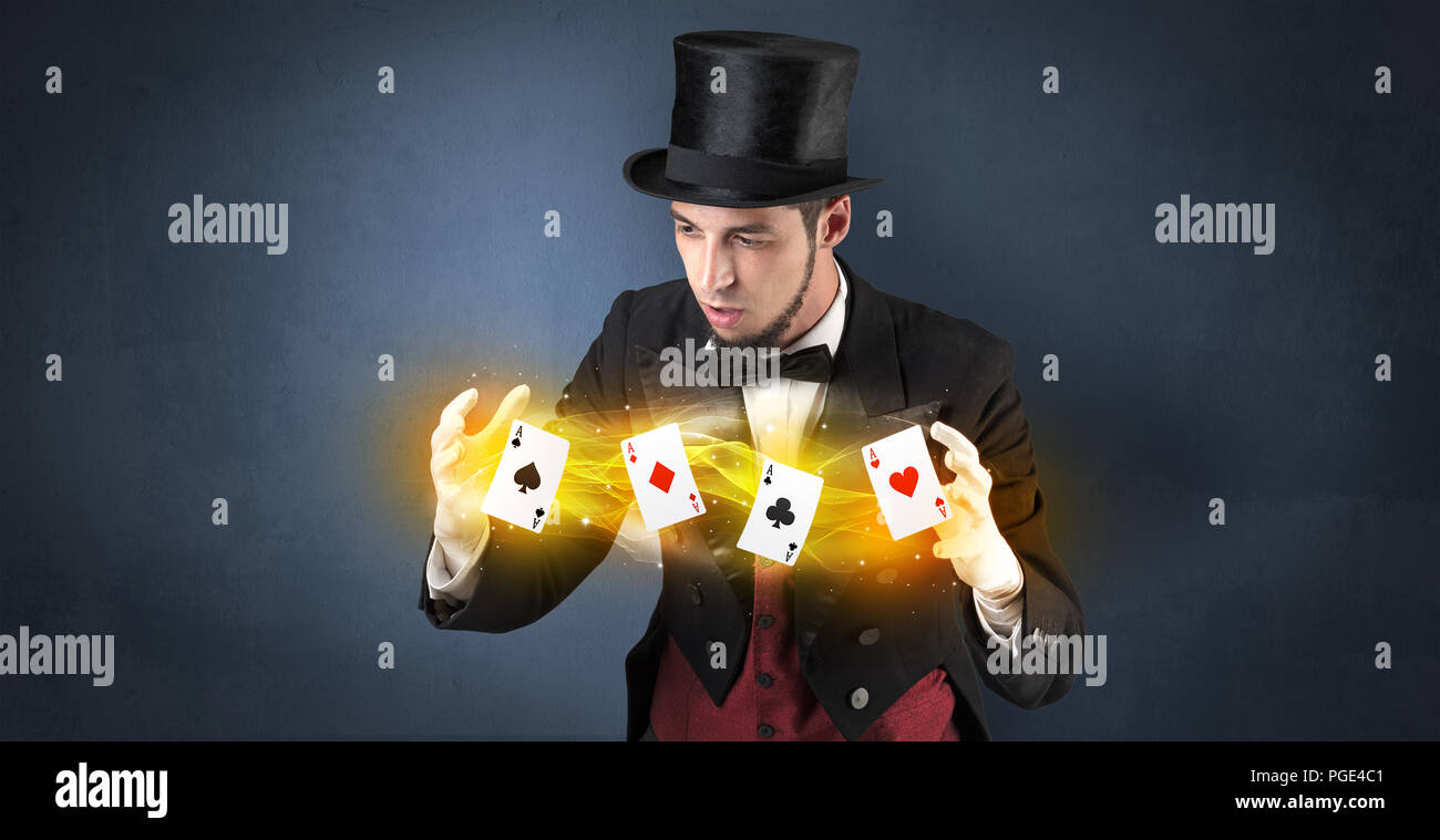 Illusionist in tails bandy play cards between his two hands Stock Photo ...