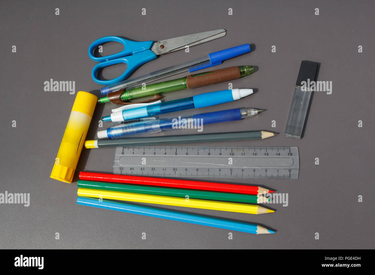 School supplies on gray background before school year Stock Photo
