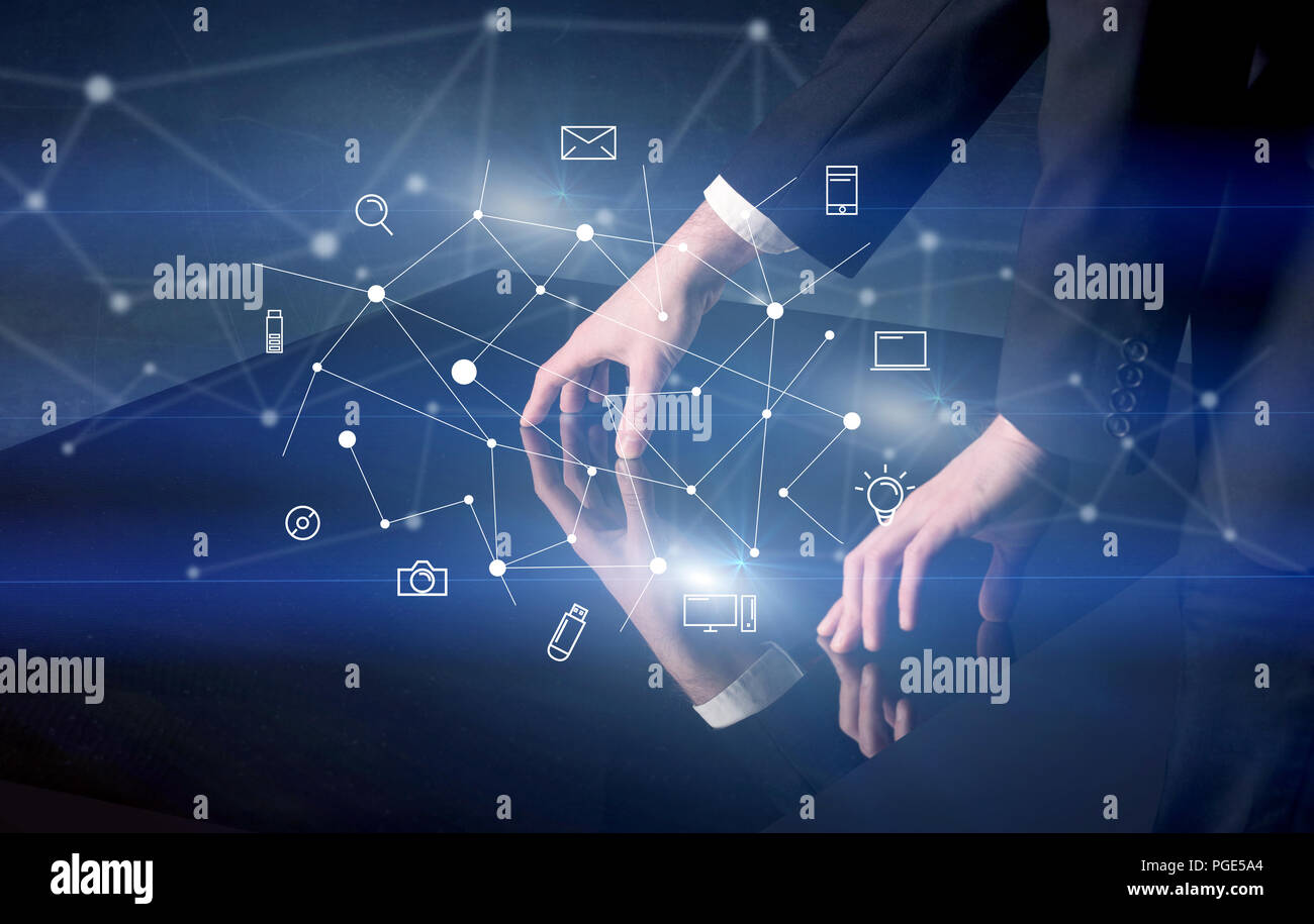 Male hands touching interactive table with blue mixed communication ...