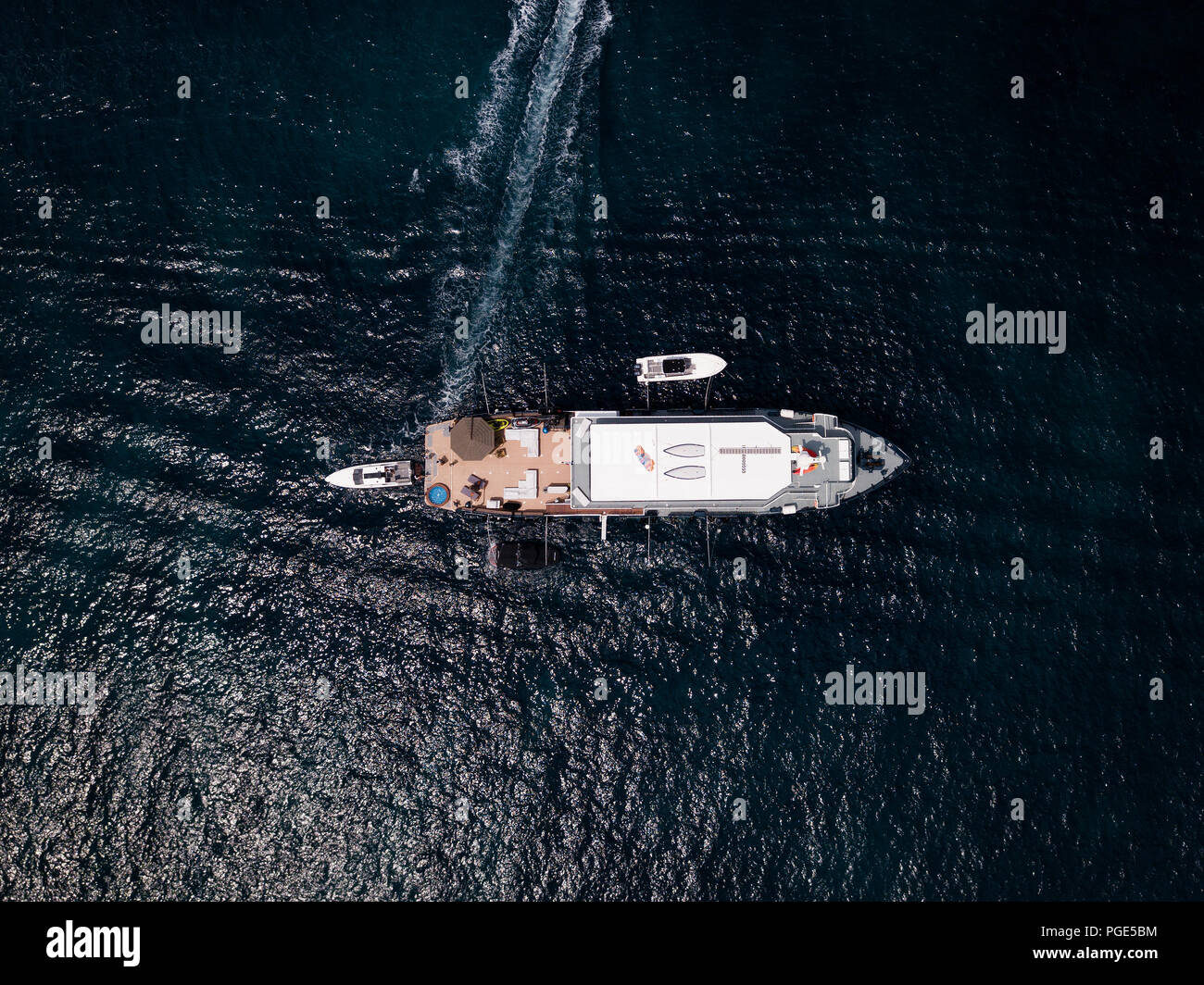 Aerial view of a luxury yacht at anchor on deep blue sea in Sardinia ...
