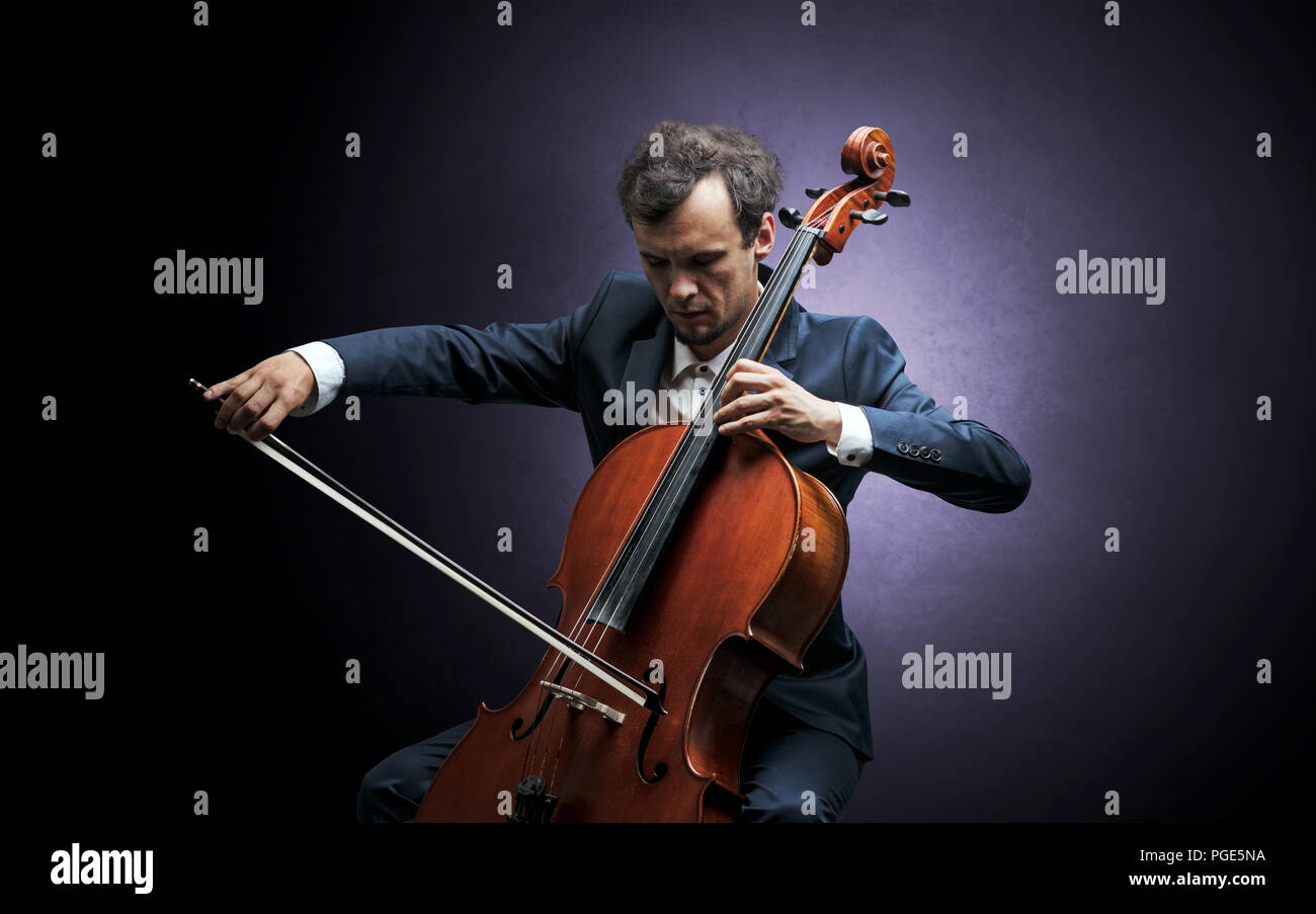 Lonely cellist composing on cello with nothing around Stock Photo - Alamy