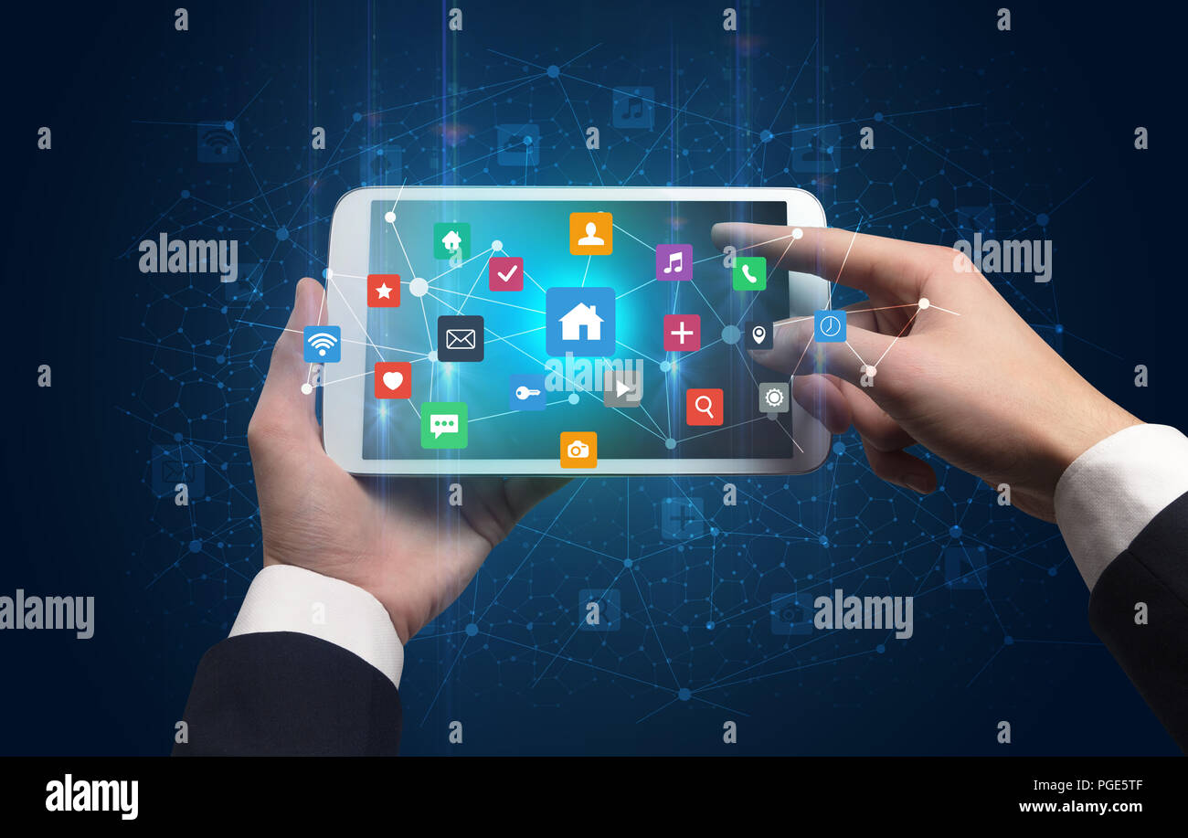Hand using tablet with colorful bounce application symbols and icons ...