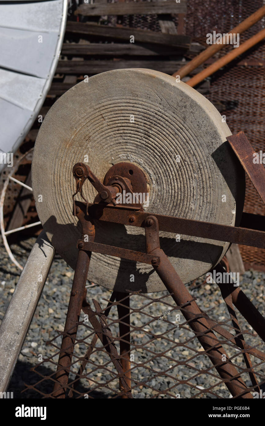 https://c8.alamy.com/comp/PGE6B4/antique-stone-grinding-wheel-PGE6B4.jpg