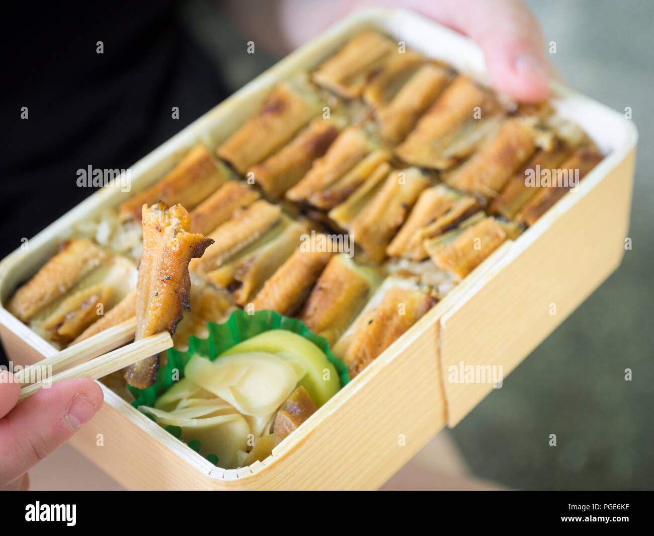 The famous conger eel lunch box (anagomeshi, anago meshi, anago-meshi) from the restaurant Ueno Anagomeshi in Miyajima-guchi, Japan. Stock Photo