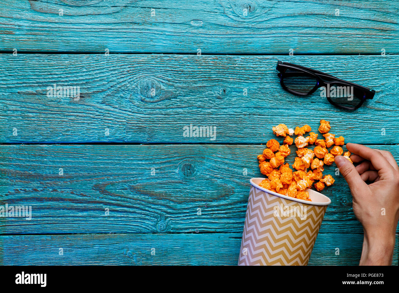 People eating popcorn. Human hands. Top view Stock Photo Alamy