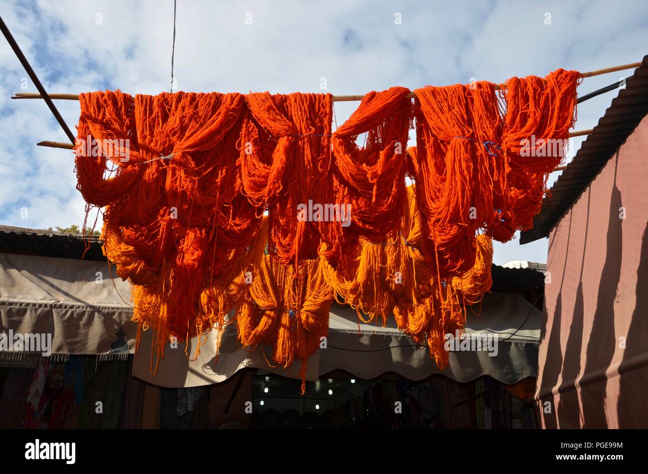 Natural wool on Marrakech market, Morocco, colored, bright, traditional, vacation, oriental, handcrafted, sale, blue sky with clouds, sunny, souk Stock Photo