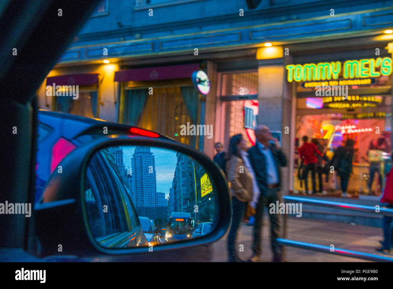 Gran Via reflected on rear view mirror, night view. Madrid, Spain. Stock Photo