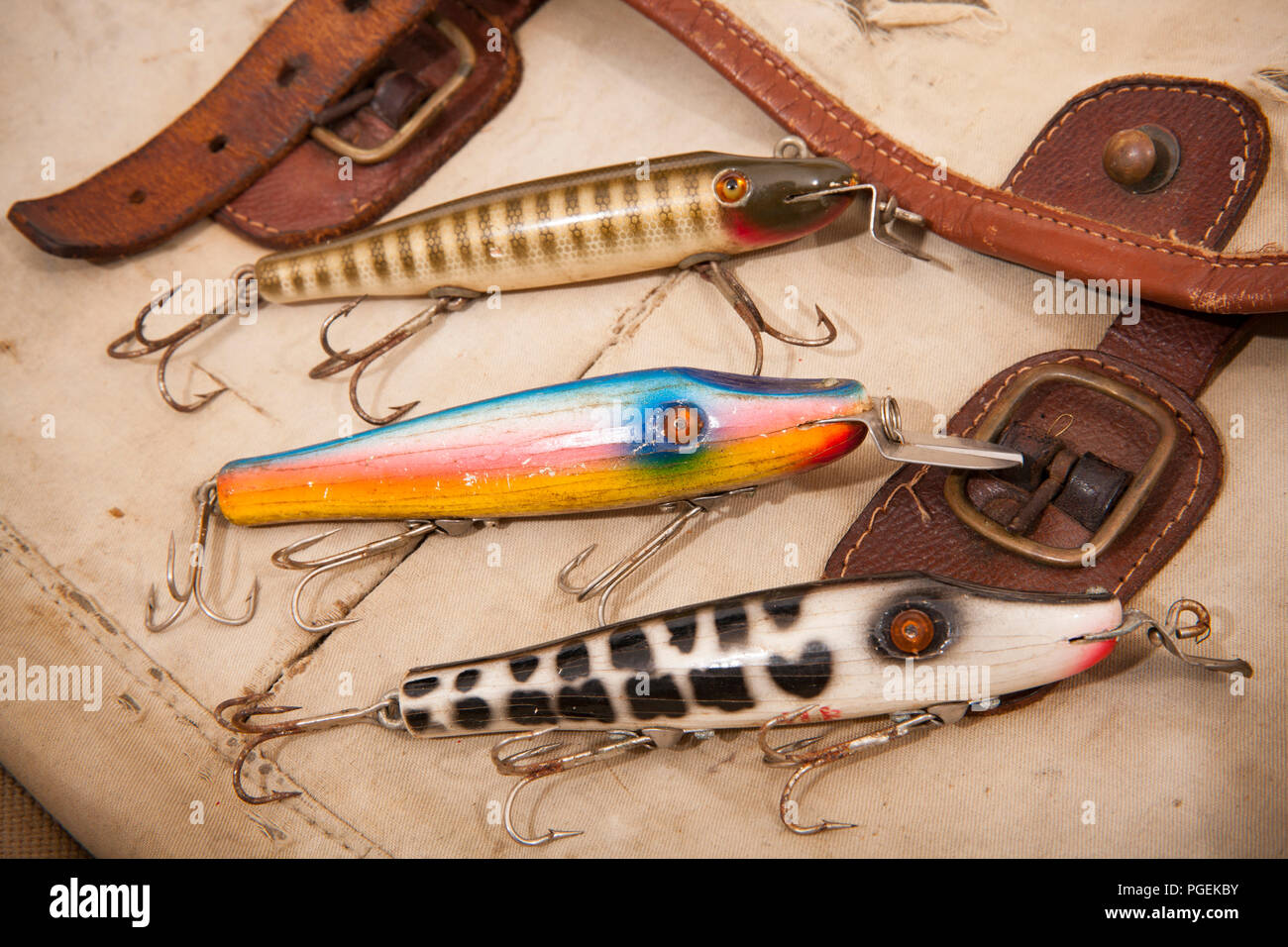 Three old Shakespeare fishing lures, or plugs, that are designed to float, but will dive when reeled in. From a collection of vintage fishing tackle.  Stock Photo