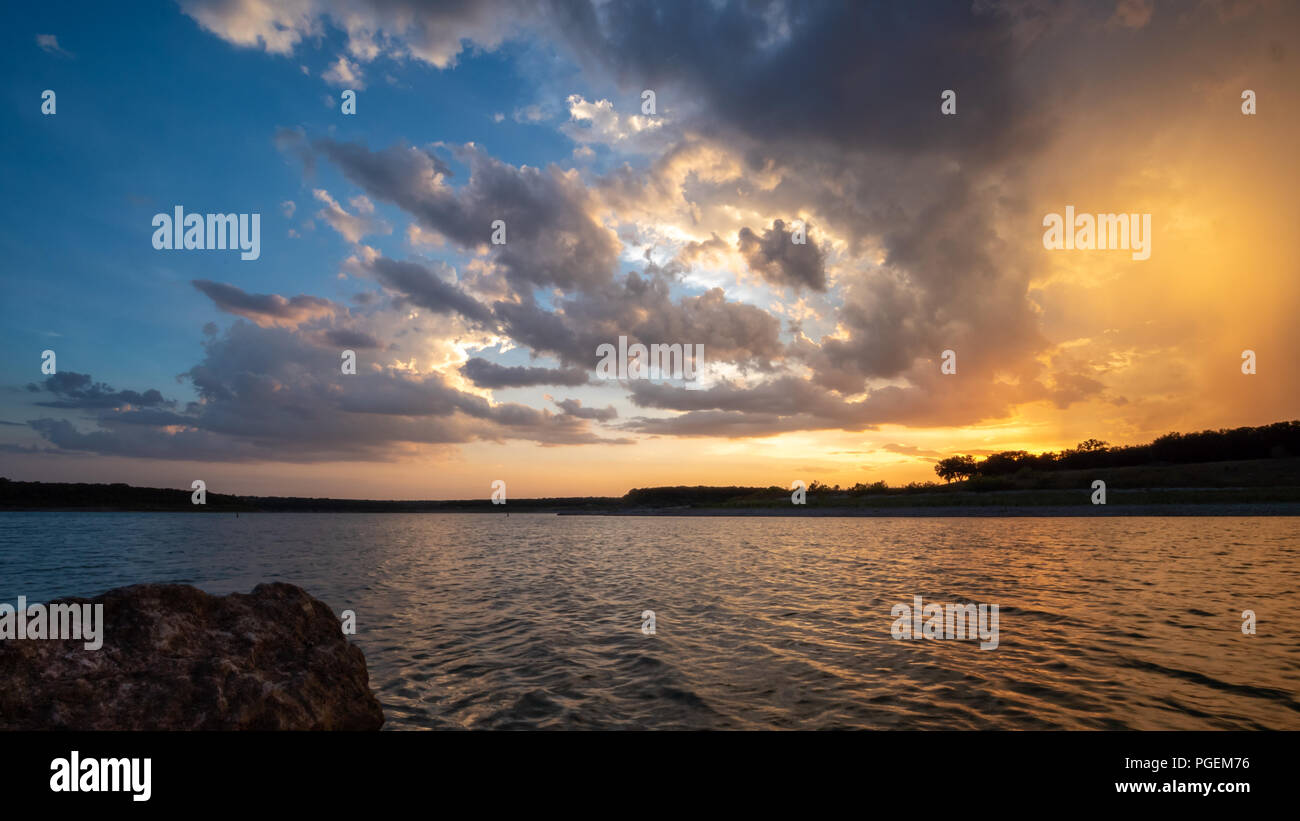 Colorful Sunset View from Shoreline of Large Texas Lake Stock Photo