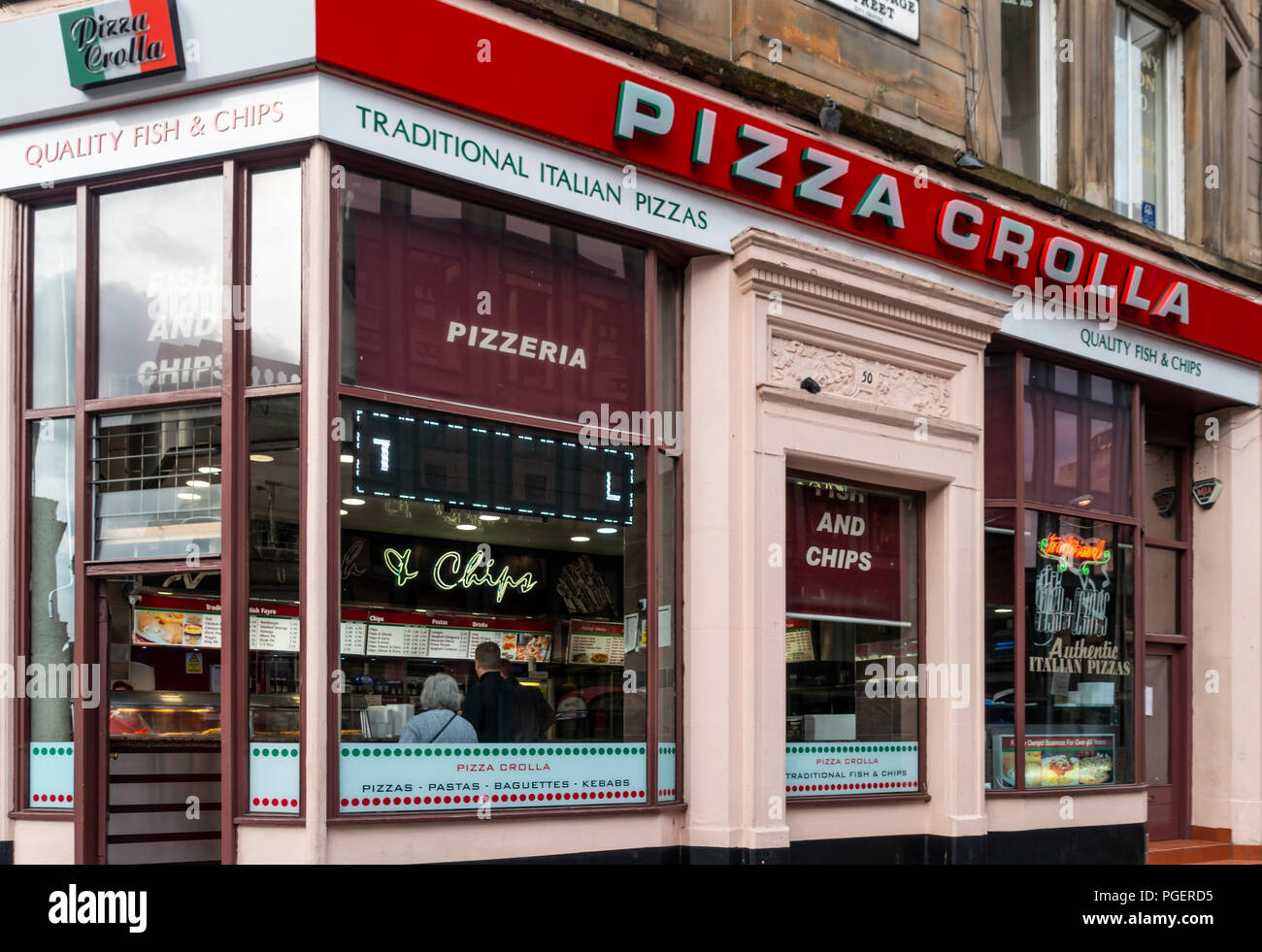 Window of a branch of the Pizza Crolla carry out restaurant chain in central Glasgow Stock Photo