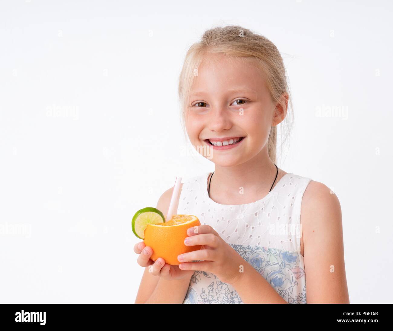 Little girl making fresh orange hires stock photography and images Alamy