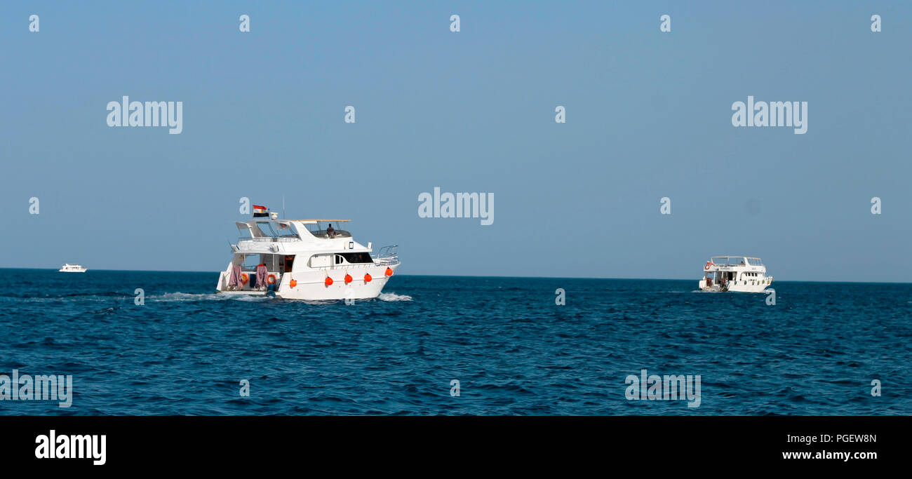 White Ship Moving By The Red Sea Stock Photo - Alamy