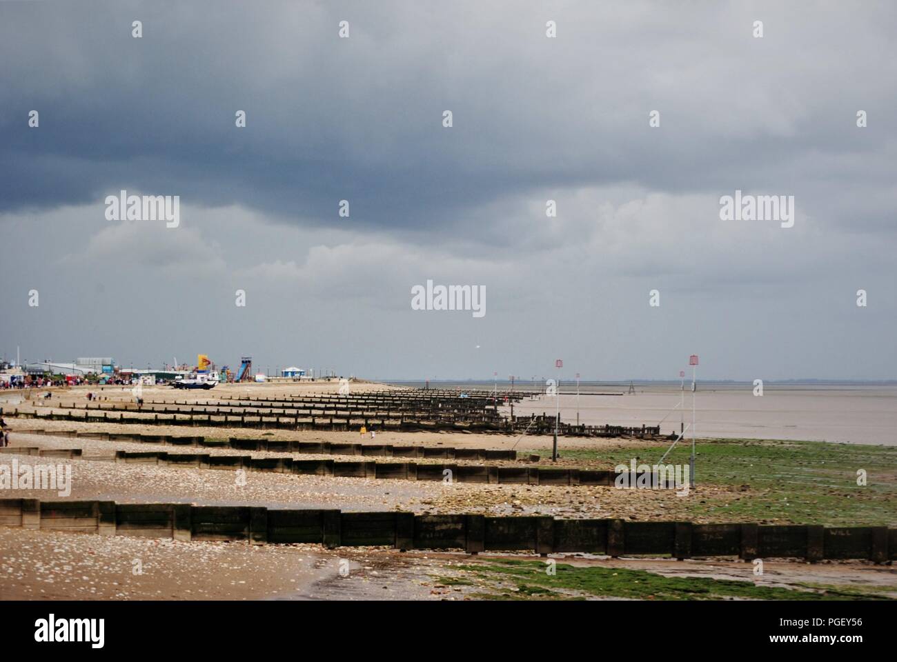 Hunstanton seaside beach with dark clouds looming overhead Stock Photo