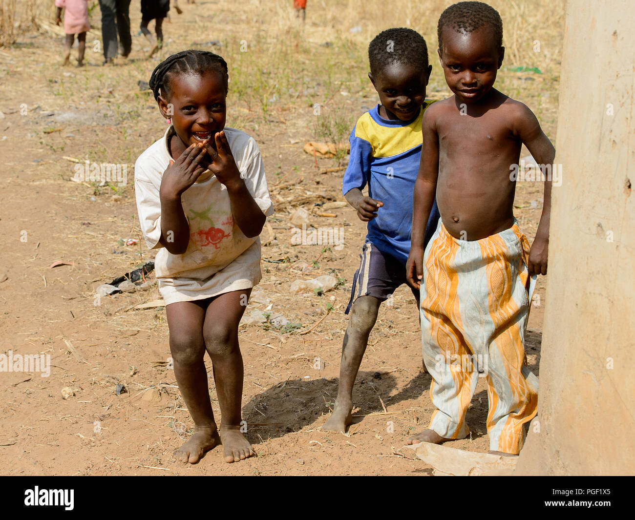 GHANI, GHANA - JAN 14, 2017: Unidentified Ghanaian two little boys and a  girl in old clothes in a local village. Ghana people suffer of poverty due  to Stock Photo - Alamy