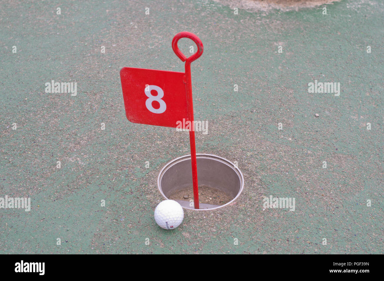 Mini Golf Putting Green Ball Hole UK Stock Photo