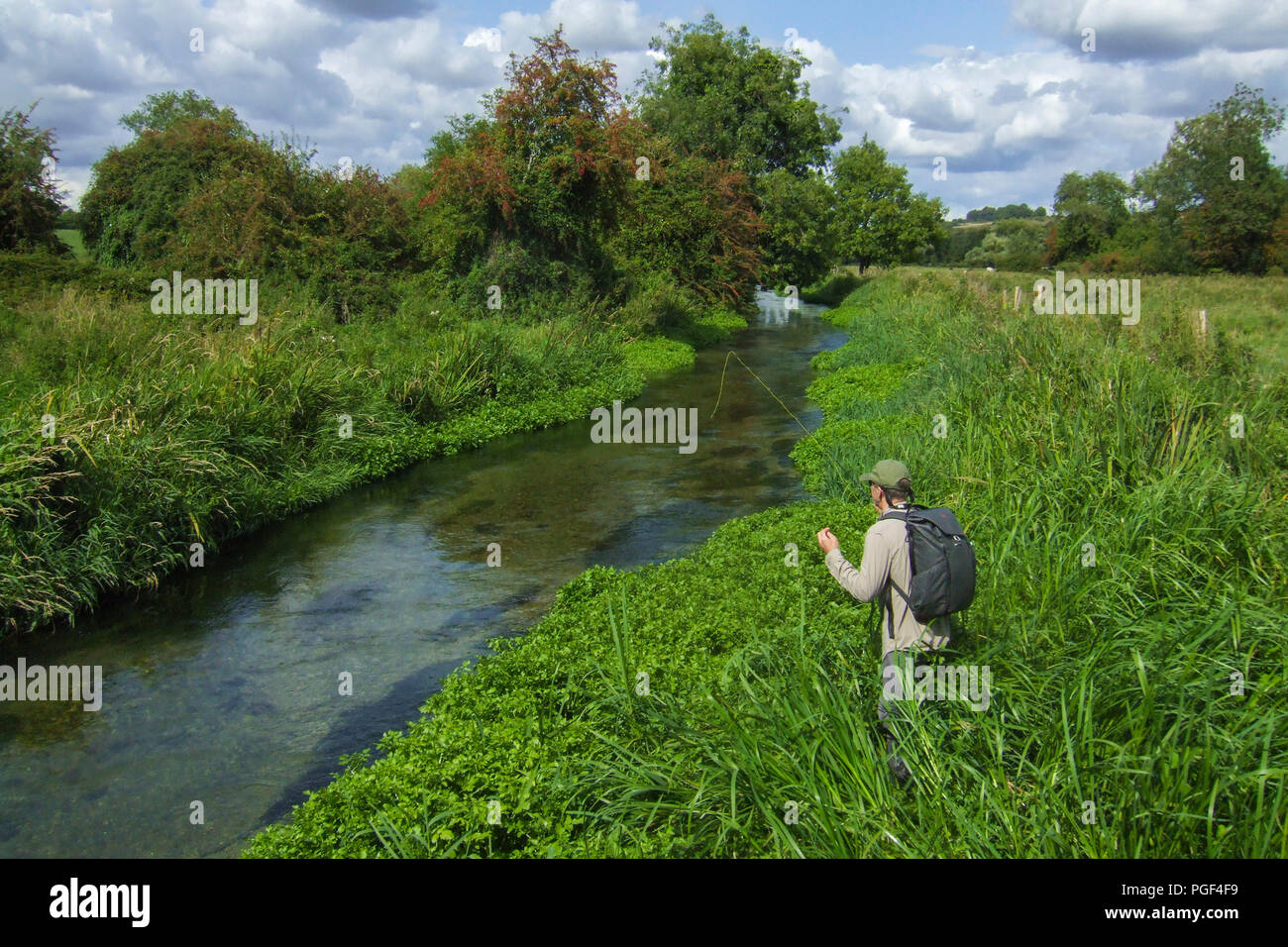A fly fisherman stalks a fish on the famous River