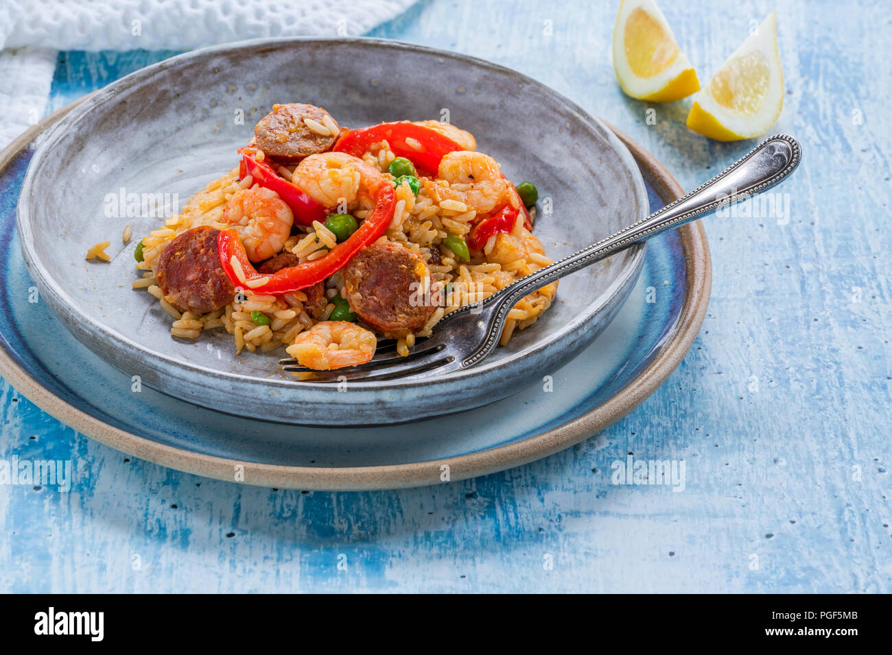 Spanish paella with prawns, chicken, chorizo and red pepper Stock Photo