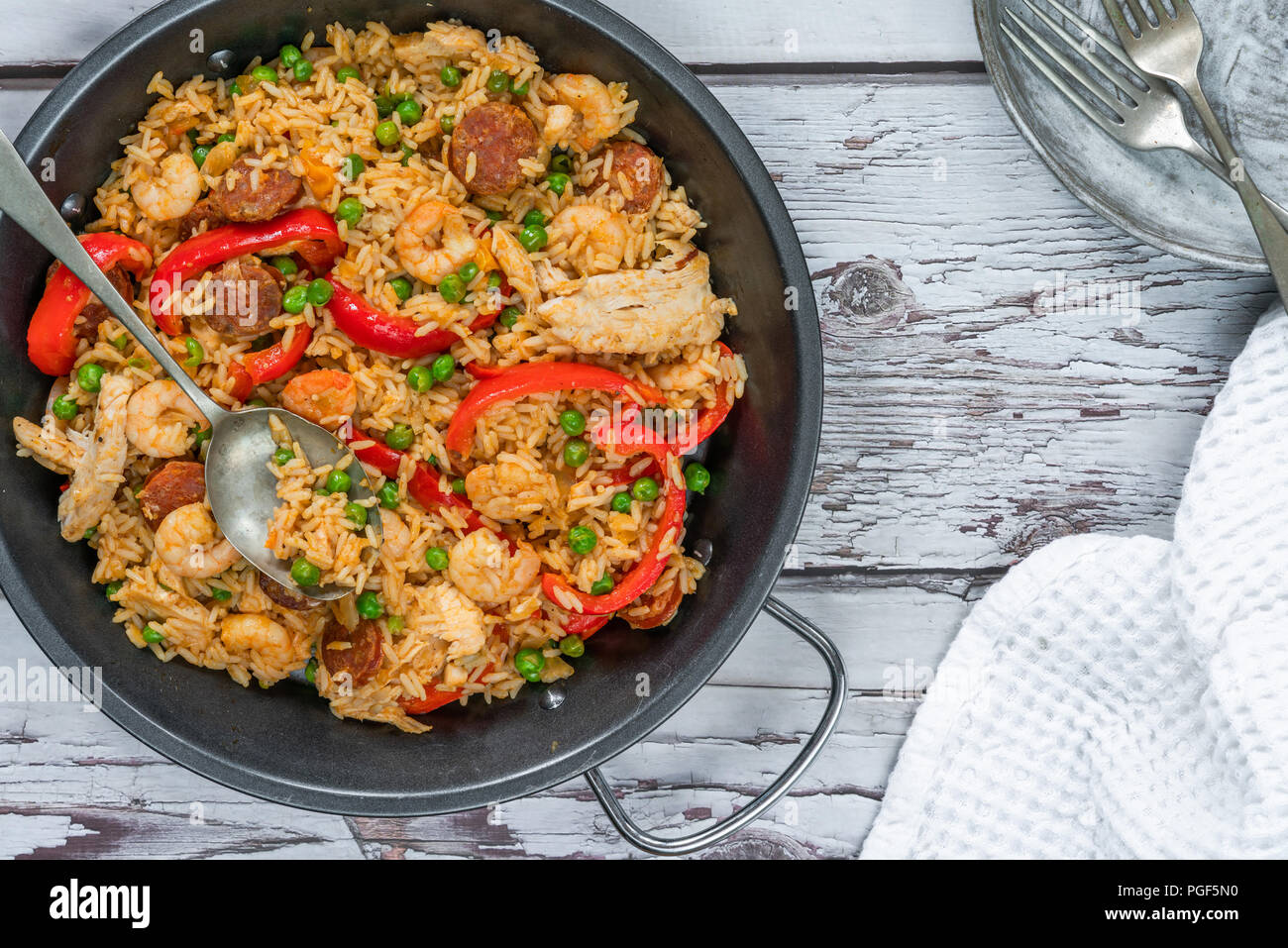 Spanish paella with prawns, chicken, chorizo and red pepper top view