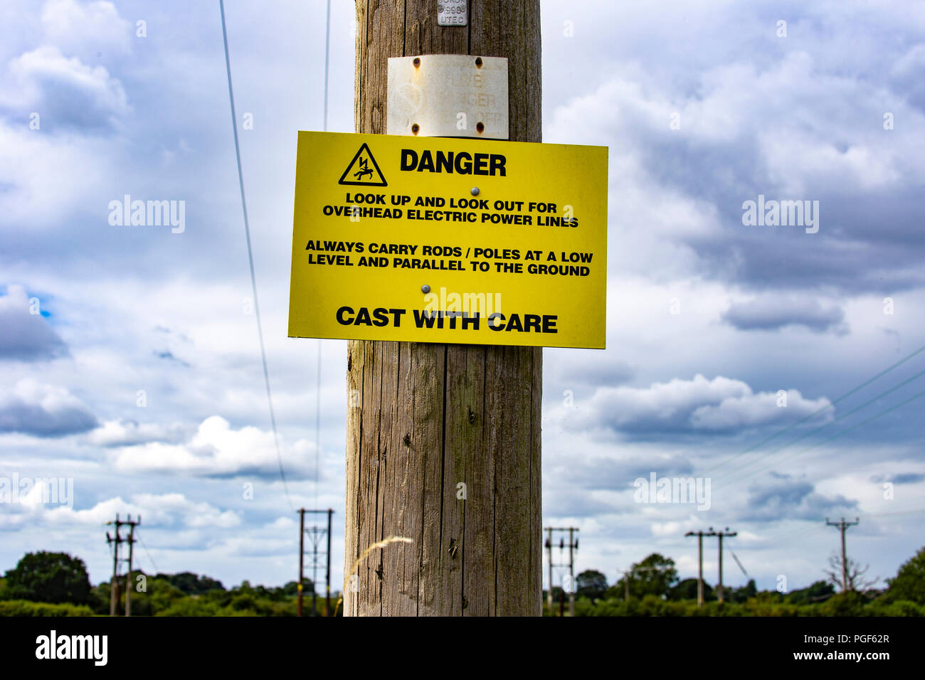 Cast with care danger sign for fishing people in Cheshire UK Stock Photo