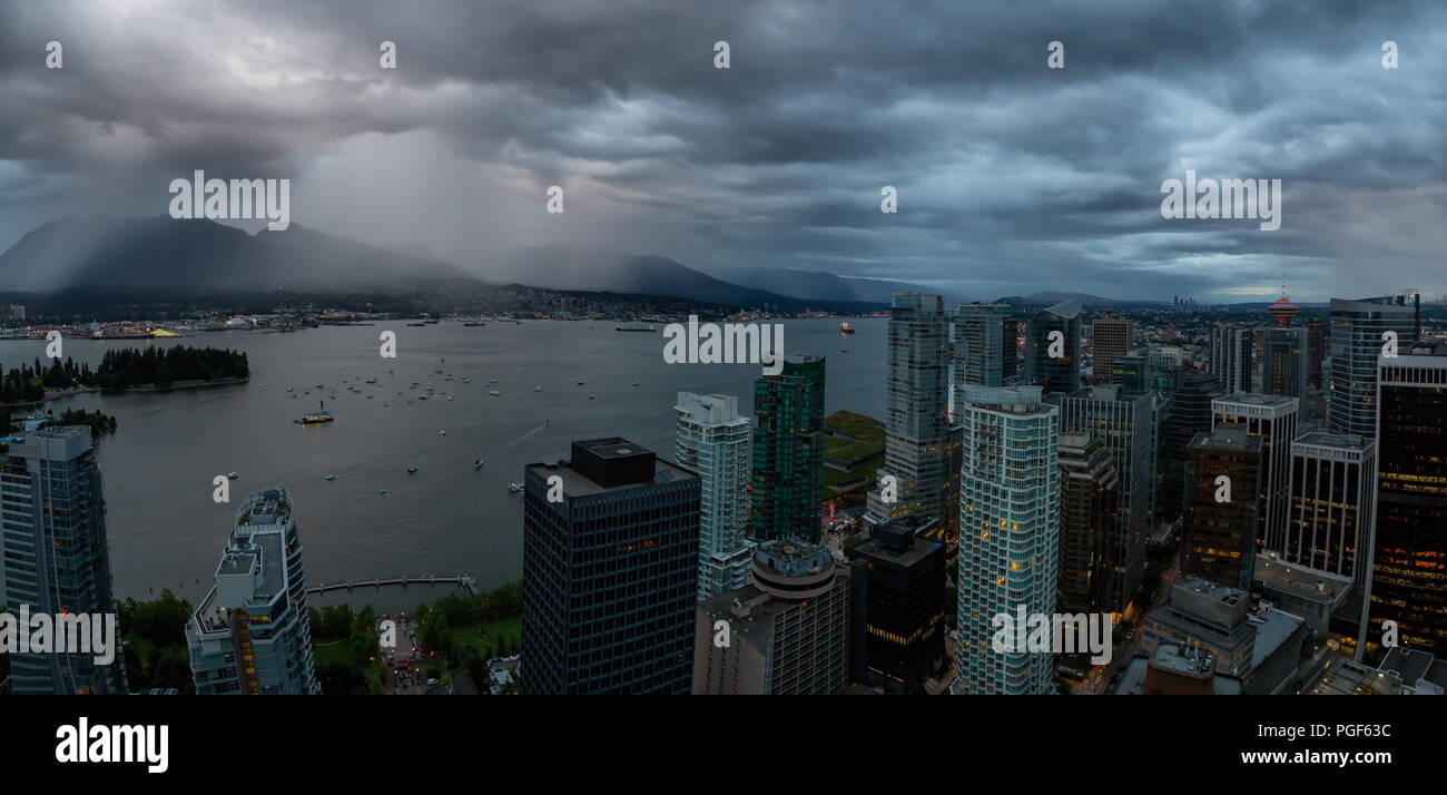 Aerial panoramic view of Downtown City during a stormy summer sunset ...