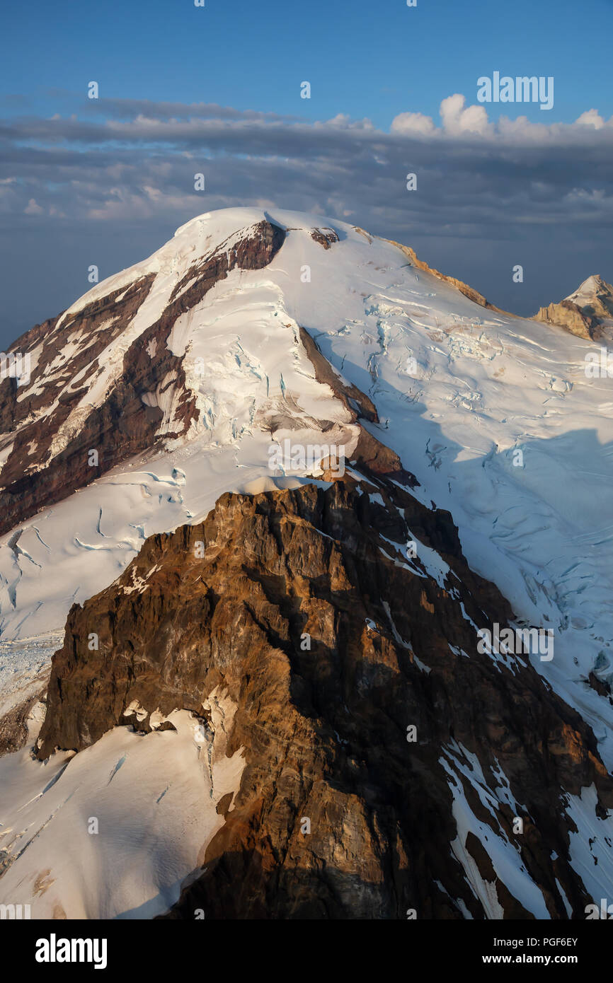 Aerial landscape view of the Mount Baker during a vibrant summer sunset. Located Northeast of