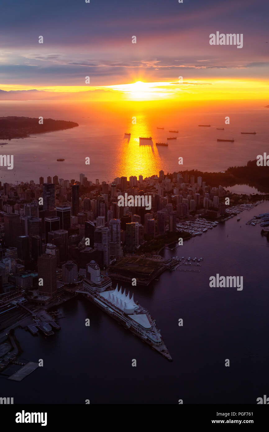 Aerial view of Downtown City during a striking and dramatic sunset ...