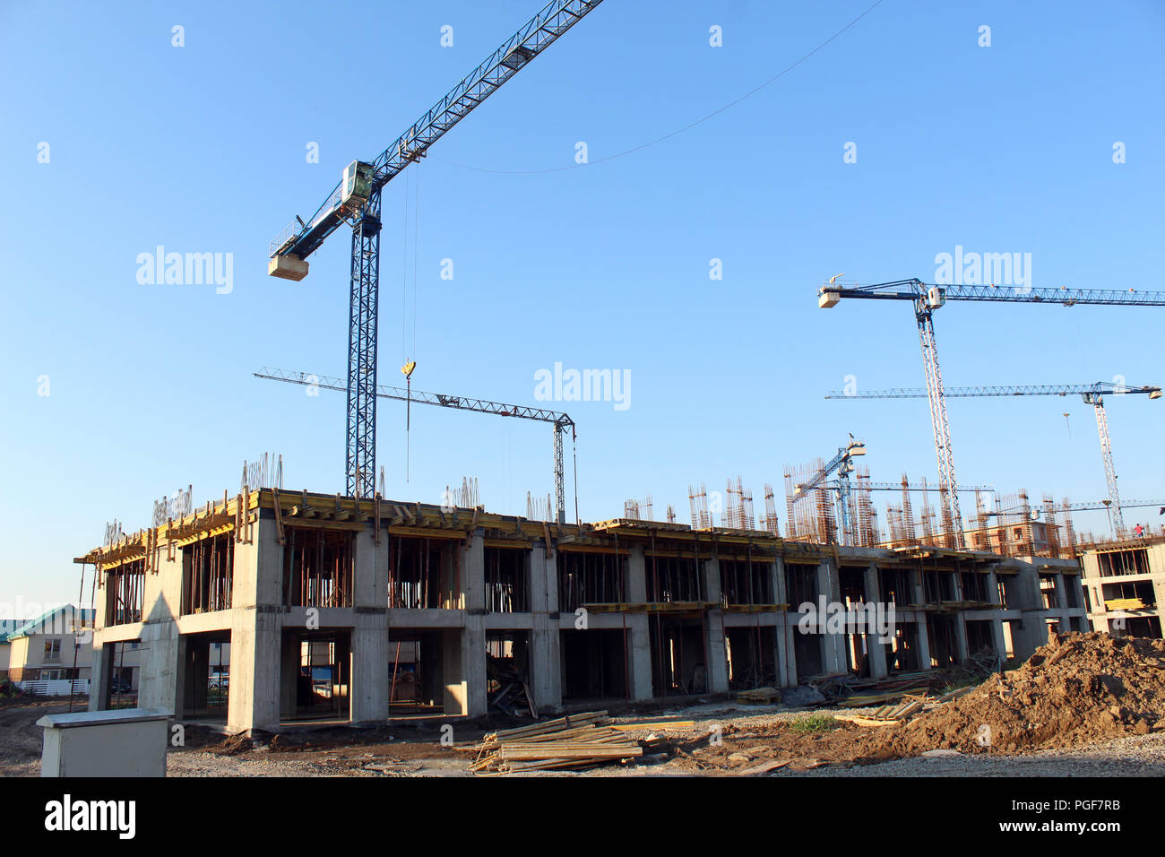 Large construction site including several cranes working on a building ...