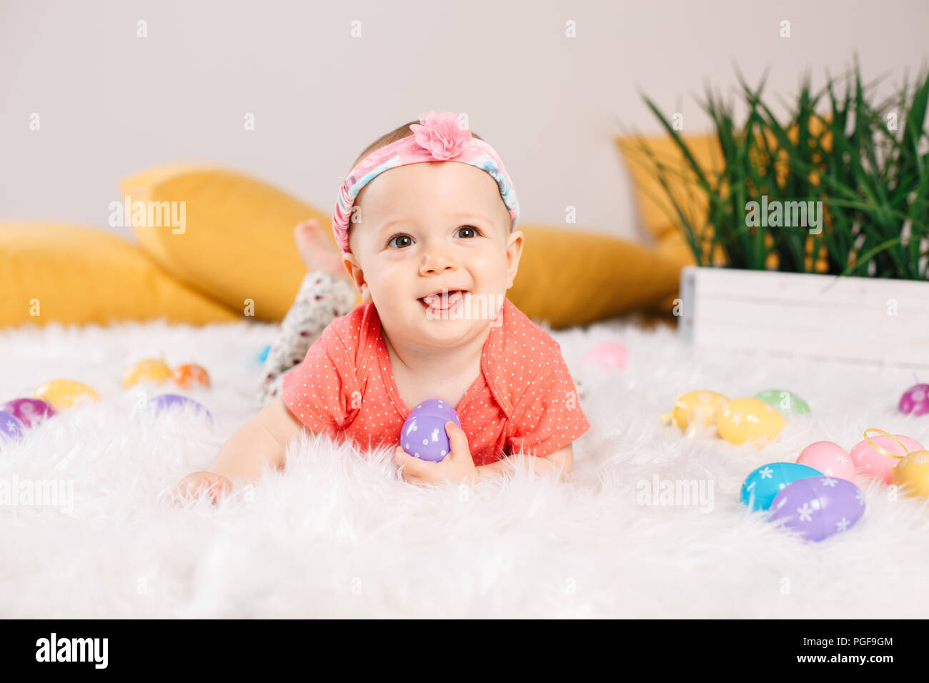 Cute adorable Caucasian baby girl in red onesie t-shirt sitting on ...