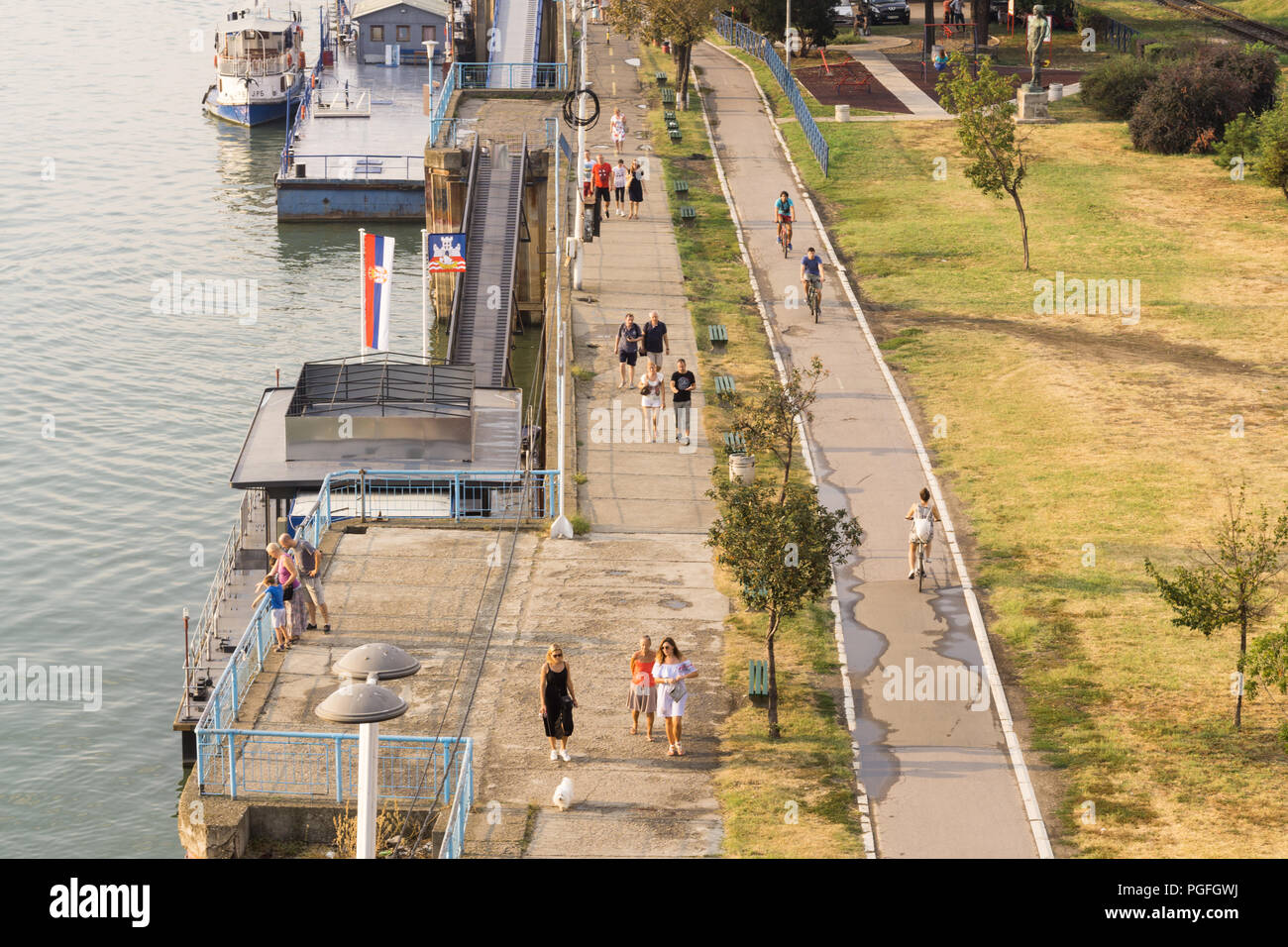 Belgrade bicycle path - Top view of people strolling and cycling along the Sava River waterfront in Belgrade, Serbia, Europe. Stock Photo