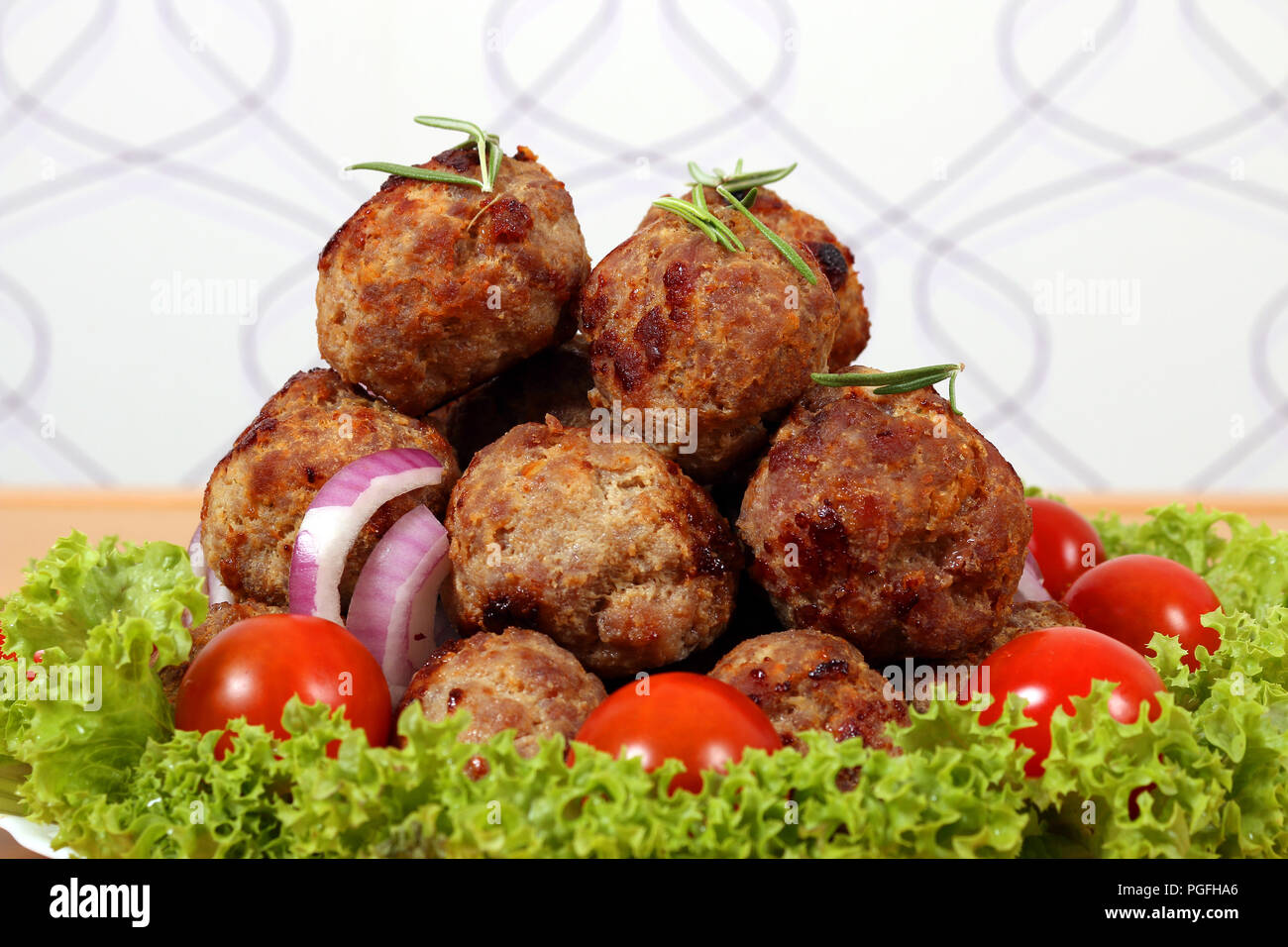 meatballs with tomatoes and salad Stock Photo