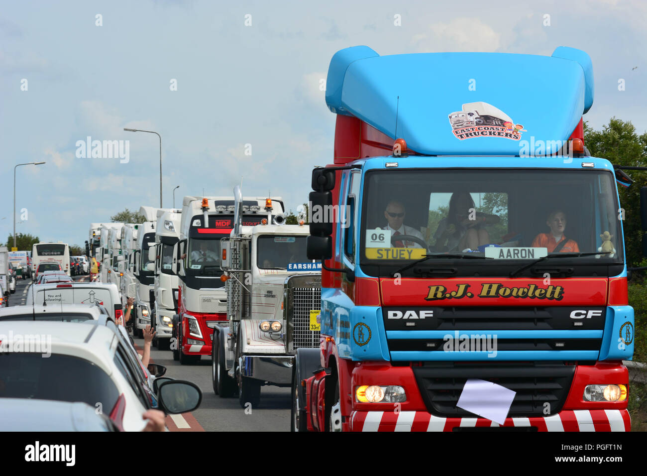 Norfolk, UK. 26 August 2018.  Over 80 Local trucking businesses provide the transport for disabled children to enjoy a day out at Pleasurewood Hills in Norfolk. The trucks travel along the Acle Straight and then along the Bypass and onto Pleasure wood hills where the children enjoy a day of fun Credit: kevin Hodgson/Alamy Live News Stock Photo