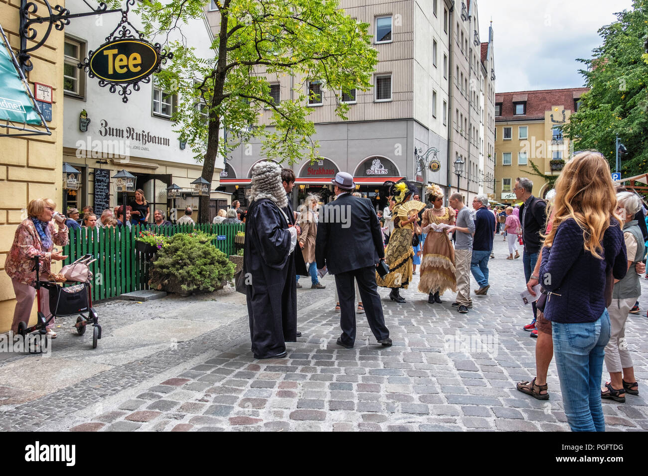 Berlin, Germany. 25 August 2018.  Nikolai Festival, Nikolaifestpiele, historic festival relates the history of Berlin from the Rococo to the Industrial era. The fifth Nikolai Festival entertains with street music, plays & poetry and people wearing period dress visit the Nikolai quarter. The historic market square has numerous stalls displaying traditional crafts and goods. Credit: Eden Breitz/Alamy Live News Stock Photo