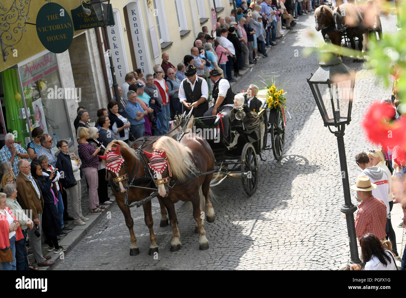 Bad Koetzting, Germany. 26th Aug, 2018. A horse-drawn carriage drives through the town during the pageant of the Koetztinger Rosstag. Credit: Felix Hörhager/dpa/Alamy Live News Stock Photo