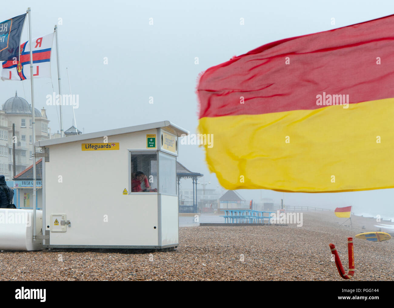 Bognor Regis, UK. 26 August 2018. August Bank Holiday in Bognor Regis a complete washout due to torrential rain, high winds and summer events cancelled. Lifeguards continue to keep a vigilant lookout over a deserted beach and raging sea. Credit: Sarnia/Alamy Live News Stock Photo