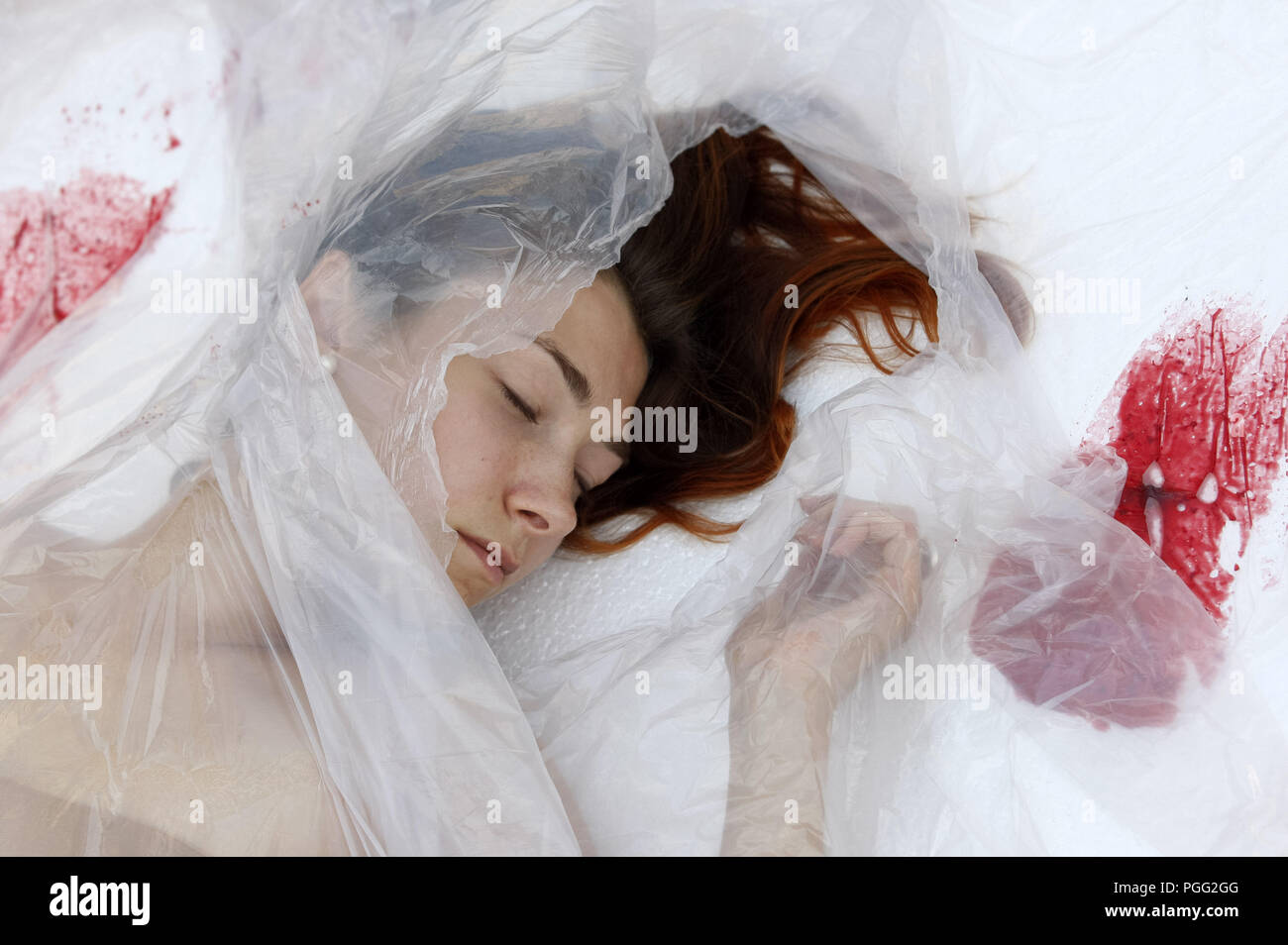Kiev, Ukraine. 26th Aug, 2018. An Ukrainian animal rights activist, covered  in plastic foils like a meat pack in a supermarket, participates at a  performance during a protest on the occasion of, image size:1300x954