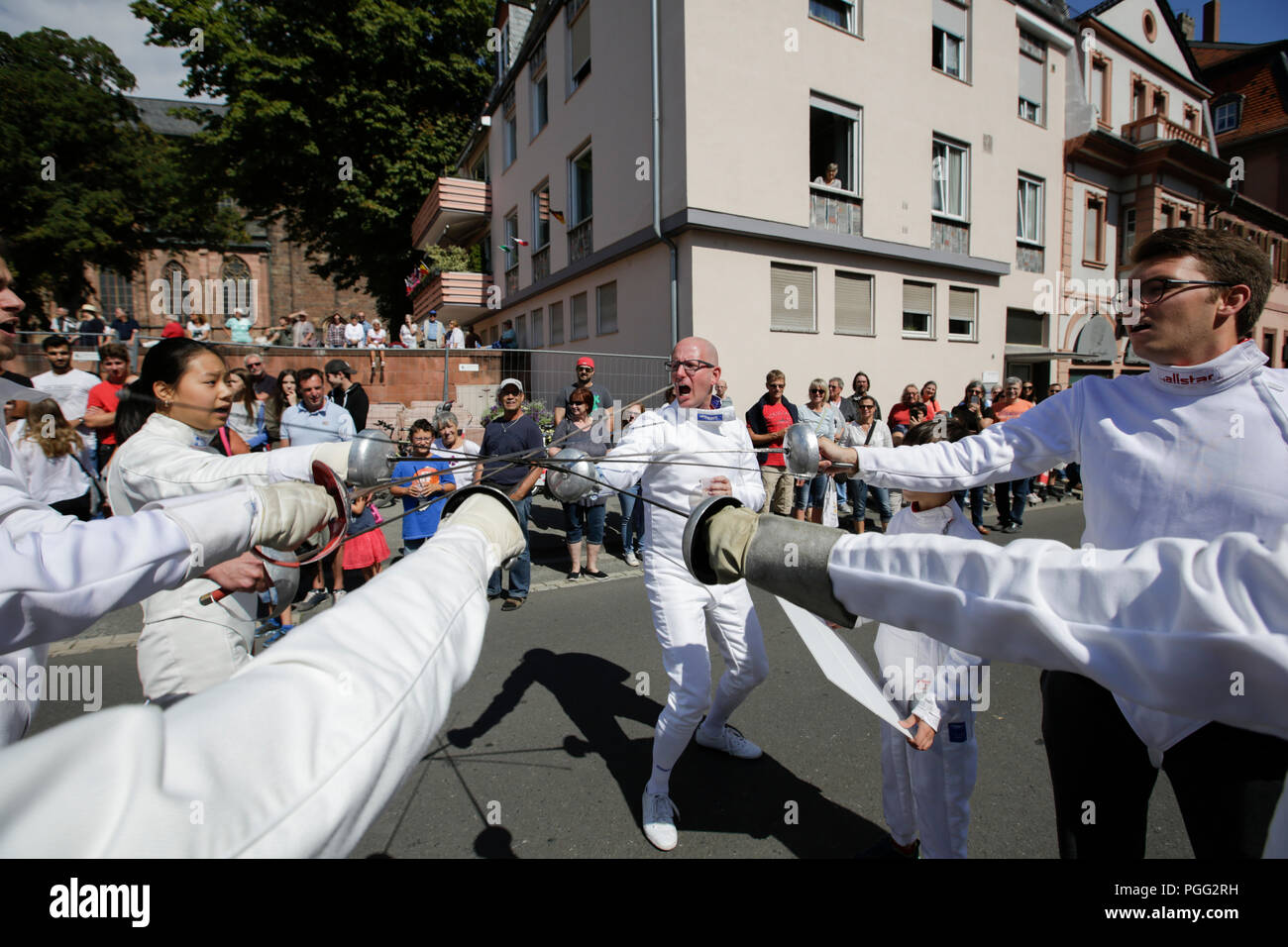 Worms, Germany. 26th August 2018. Fencers present their weapons in the parade. The first highlight of the 2018 Backfischfest was the big parade through the city of Worms with over 70 groups and floats. Community groups, music groups and businesses from Worms and further afield took part. Credit: Michael Debets/Alamy Live News Stock Photo
