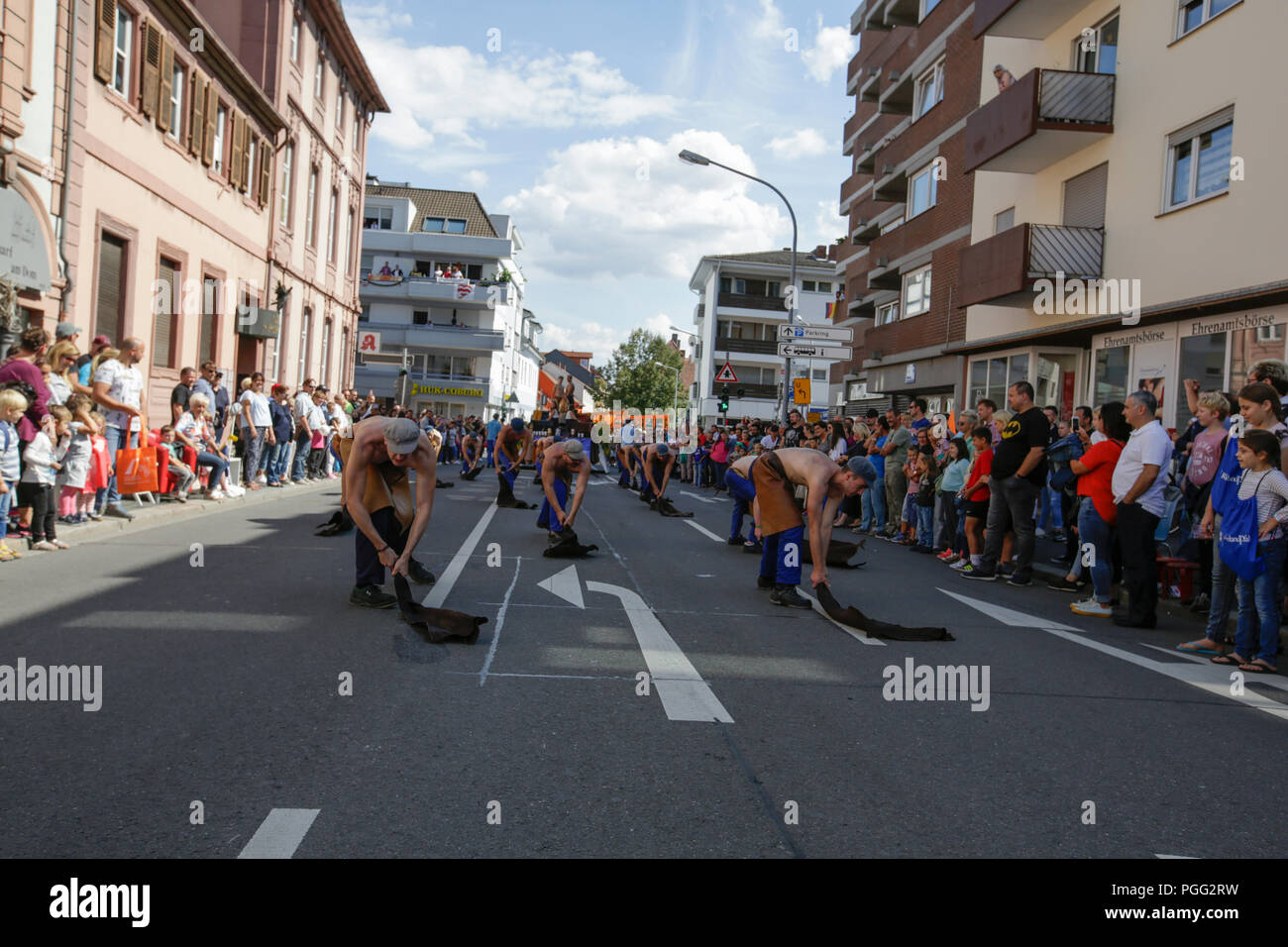 Worms, Germany. 26th August 2018. Local students perform the dance of the leather workers in the parade. The first highlight of the 2018 Backfischfest was the big parade through the city of Worms with over 70 groups and floats. Community groups, music groups and businesses from Worms and further afield took part. Credit: Michael Debets/Alamy Live News Stock Photo