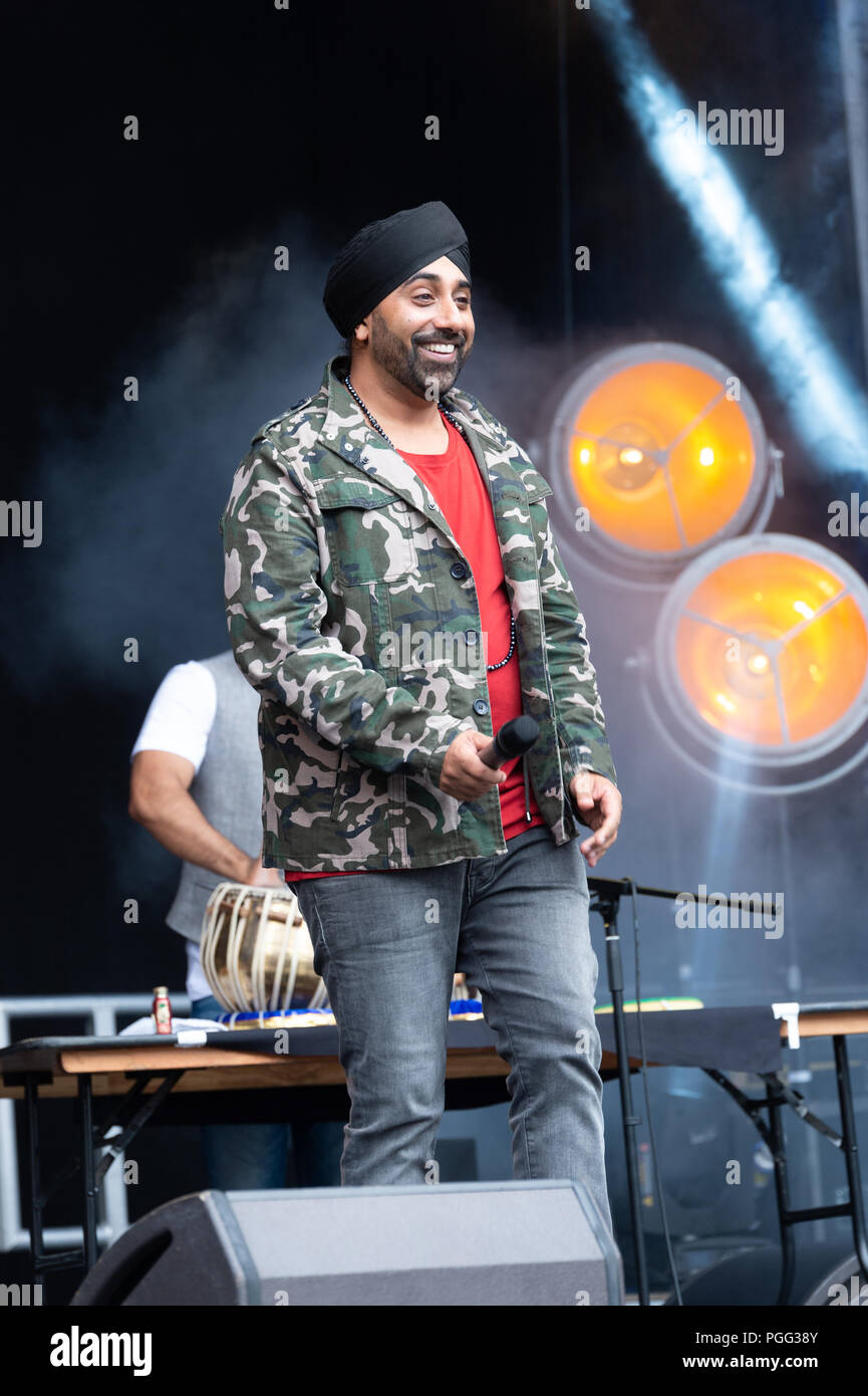 Belfast, Northern Ireland, U.K. 26 August 2018. Belfast Mela is the City's annual celebration of global cultures where thousands of people have come together to celebrate people and diversity. The Mela transformed Belfast's beautiful Botanic Gardens into a magical global garden filled with the sights, sounds and aromas of nations right around the world. Music, dance, arts and culture came together to create a heady, good humoured atmosphere which invites the world into the heart of Belfast. Credit: John Rymer/Alamy Live News Stock Photo