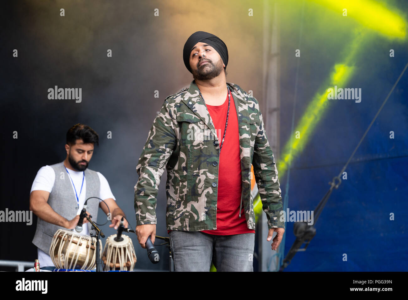 Belfast, Northern Ireland, U.K. 26 August 2018. Belfast Mela is the City's annual celebration of global cultures where thousands of people have come together to celebrate people and diversity. The Mela transformed Belfast's beautiful Botanic Gardens into a magical global garden filled with the sights, sounds and aromas of nations right around the world. Music, dance, arts and culture came together to create a heady, good humoured atmosphere which invites the world into the heart of Belfast. Credit: John Rymer/Alamy Live News Stock Photo